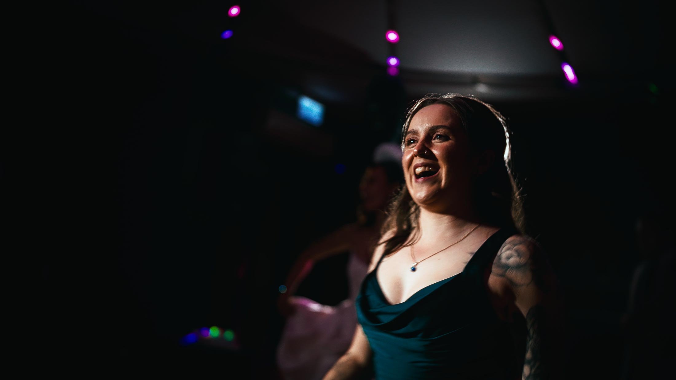 Bridesmaid dances during a high-energy after party at Elmore Court.
