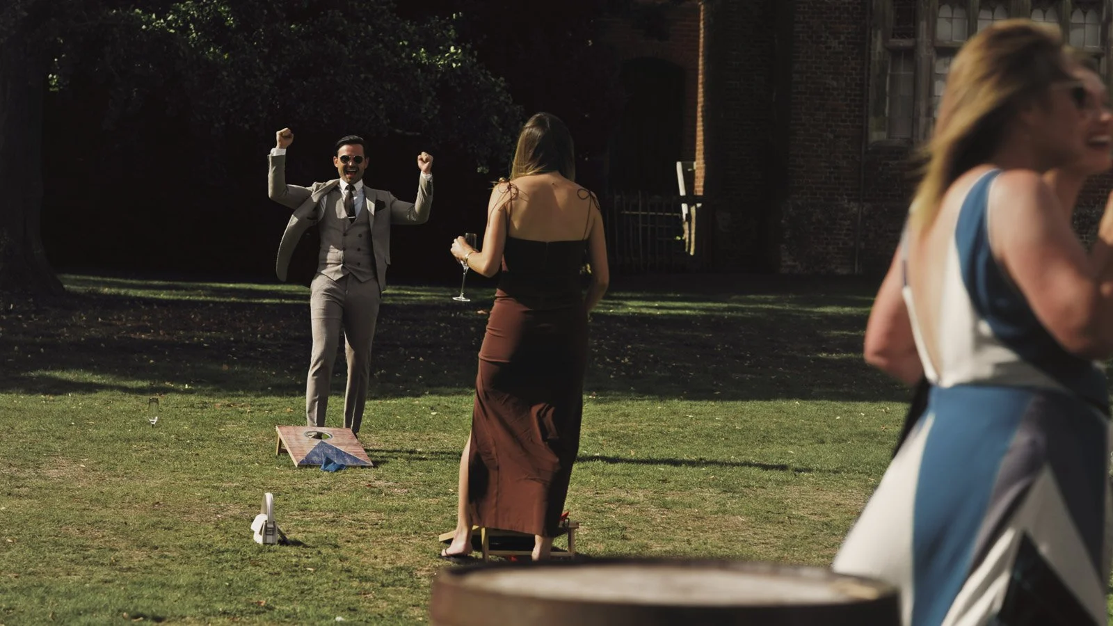 Guests and atmosphere from a colourful riverside wedding with black-tie styling and a marquee party on the Thames.