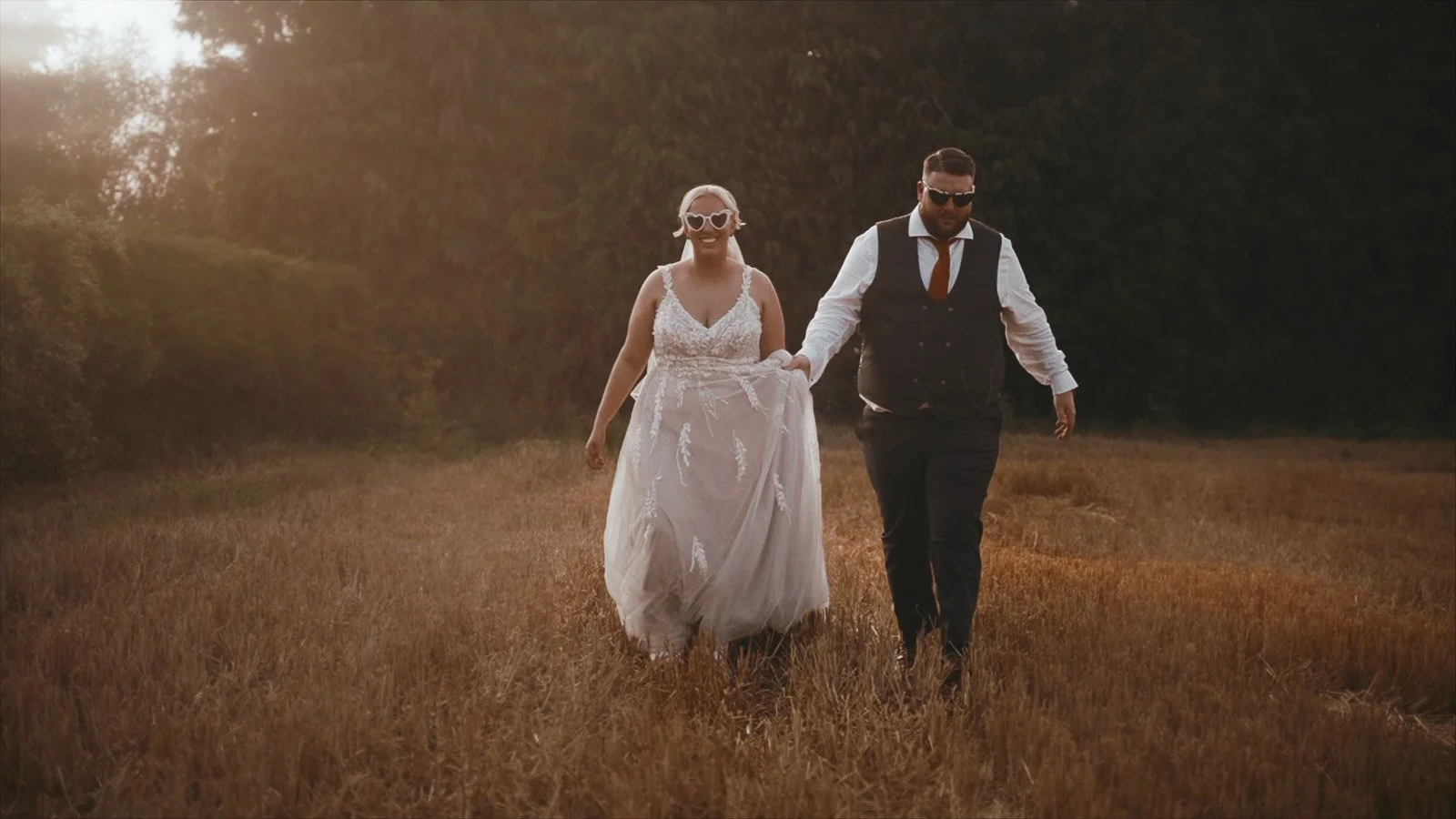 Editorial couple portrait on the grounds of Winters Barns with soft background blur and cinematic tones.