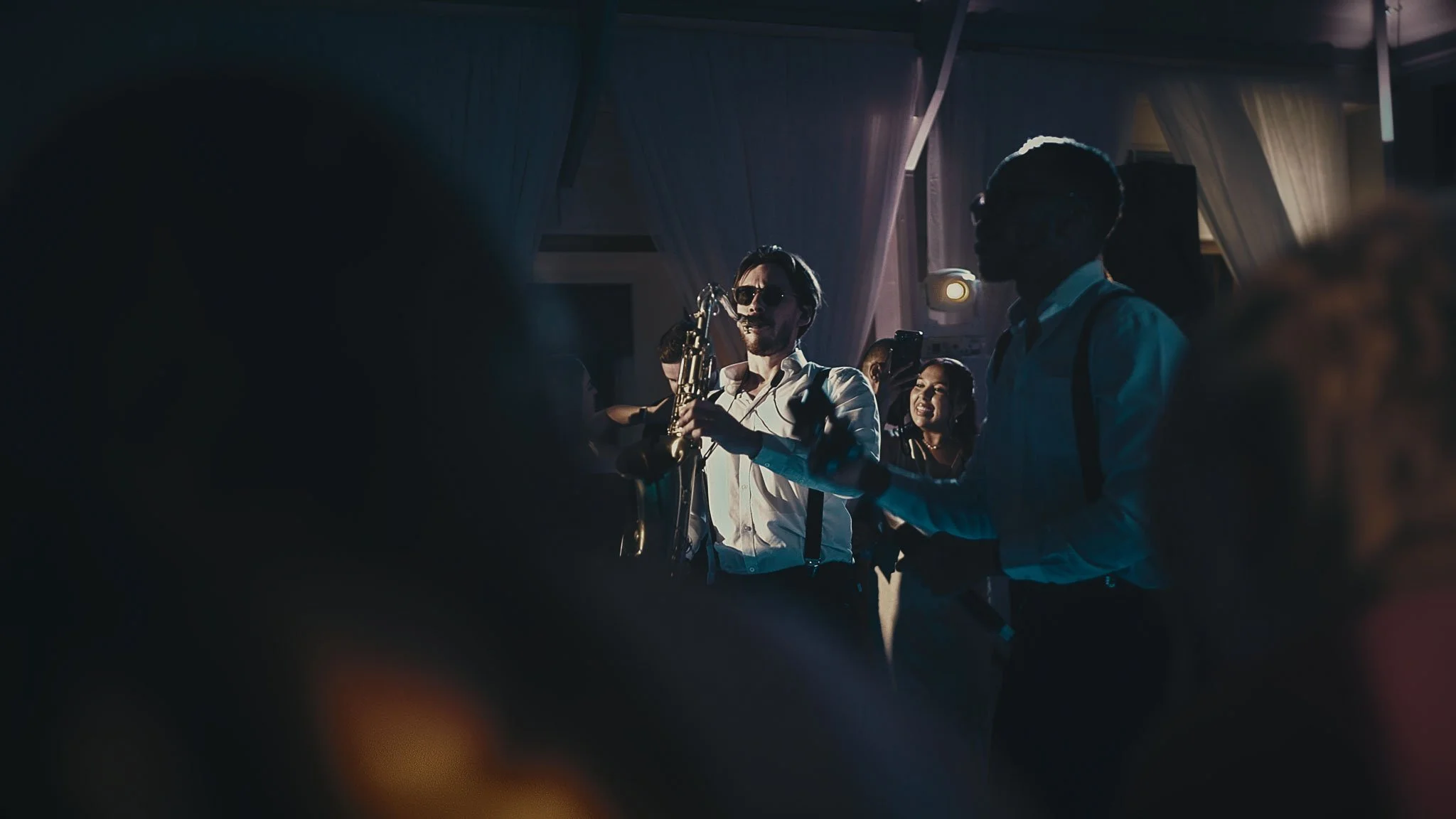 Guest reactions during live music in the Botleys Mansion Atrium as the evening celebration builds.
