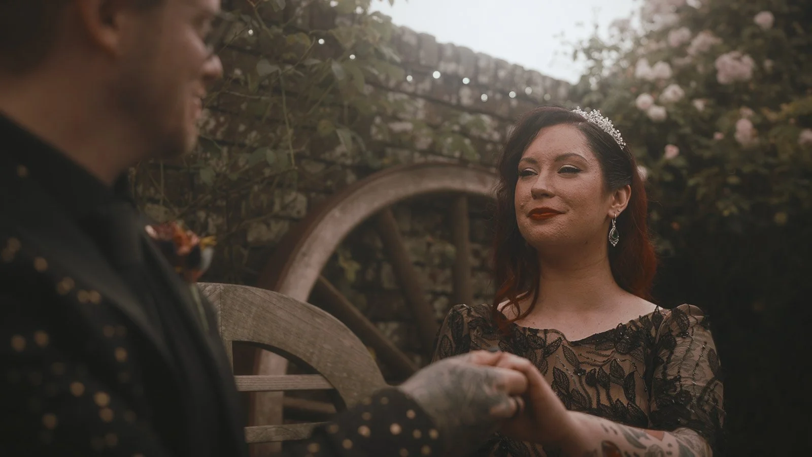 Alternative wedding couple laughing together during portraits at Winters Barns