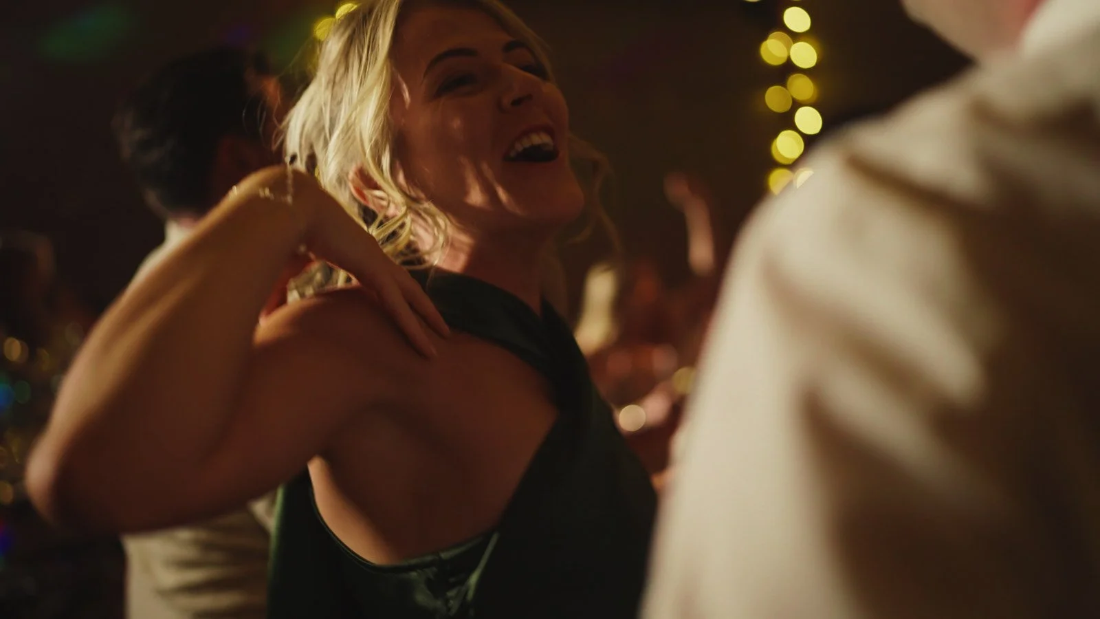 Guests and atmosphere from a colourful riverside wedding with black-tie styling and a marquee party on the Thames.