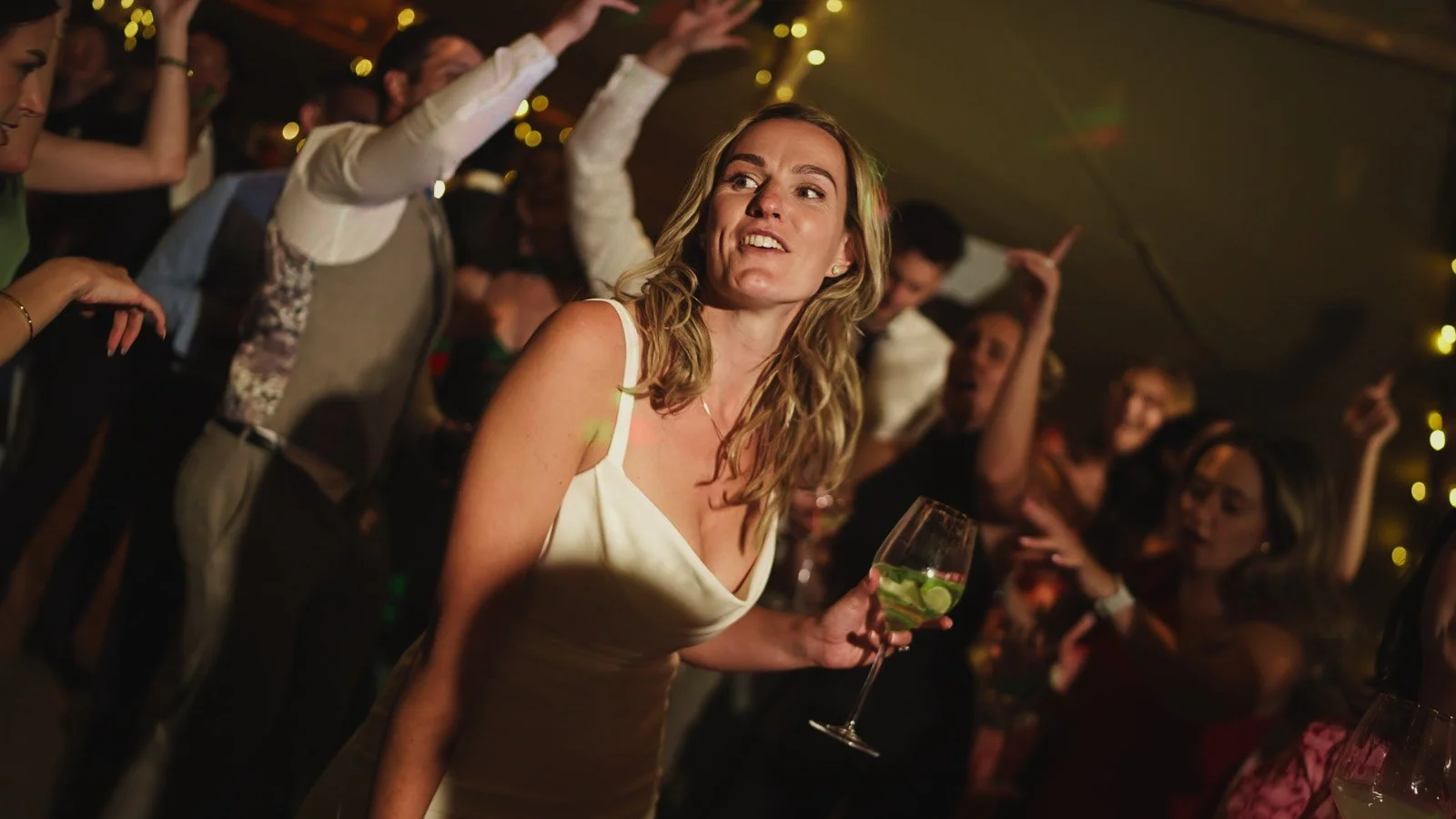 Candid moments from a colourful riverside wedding on the River Thames at an Oxfordshire country estate.