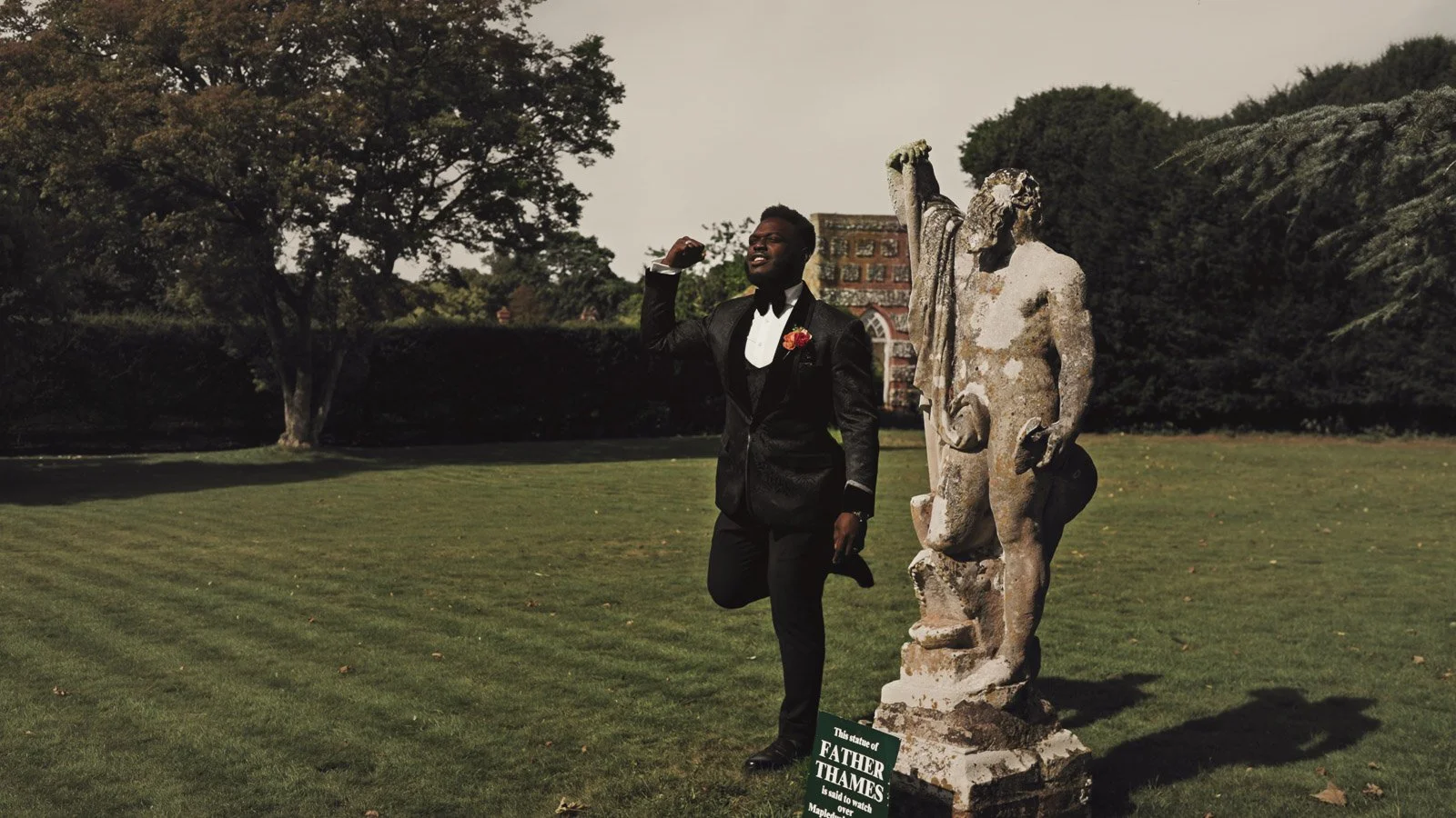 Editorial-style wedding photography from a colourful riverside celebration with bold florals and a marquee reception.