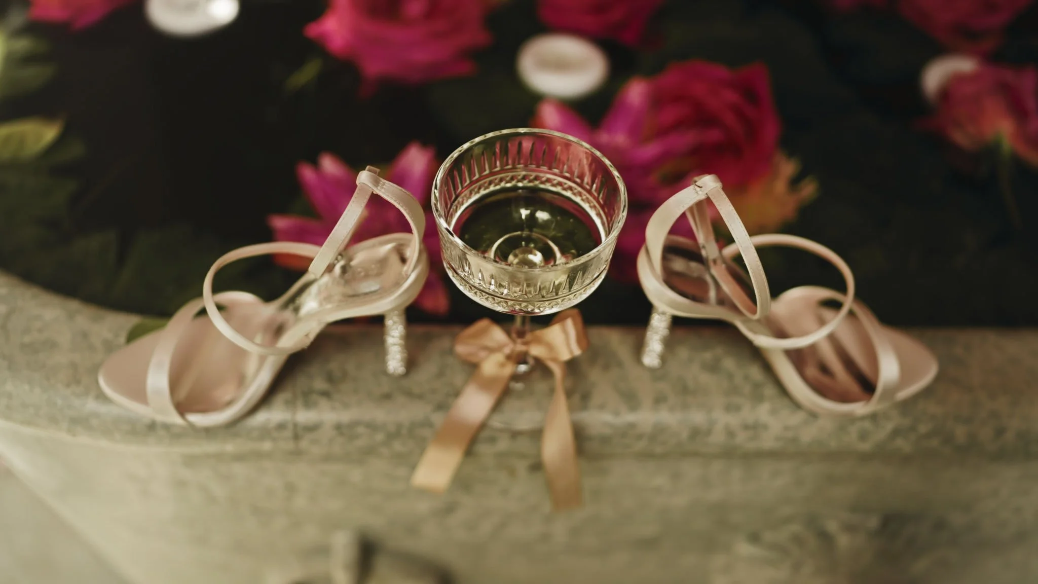 Guests mingling with drinks in the Moroccan Courtyard at Port Lympne, an atmospheric interlude before the Orangery.