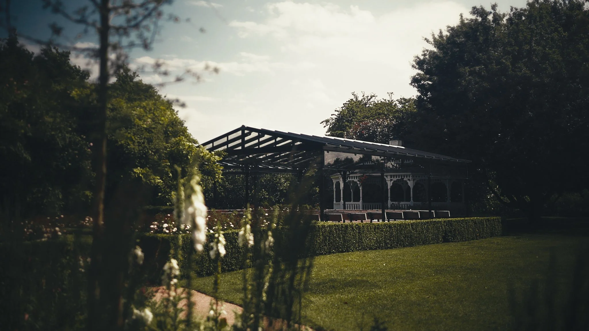 Wide view of guests during an outdoor garden ceremony at The Old Kent Barn in Kent