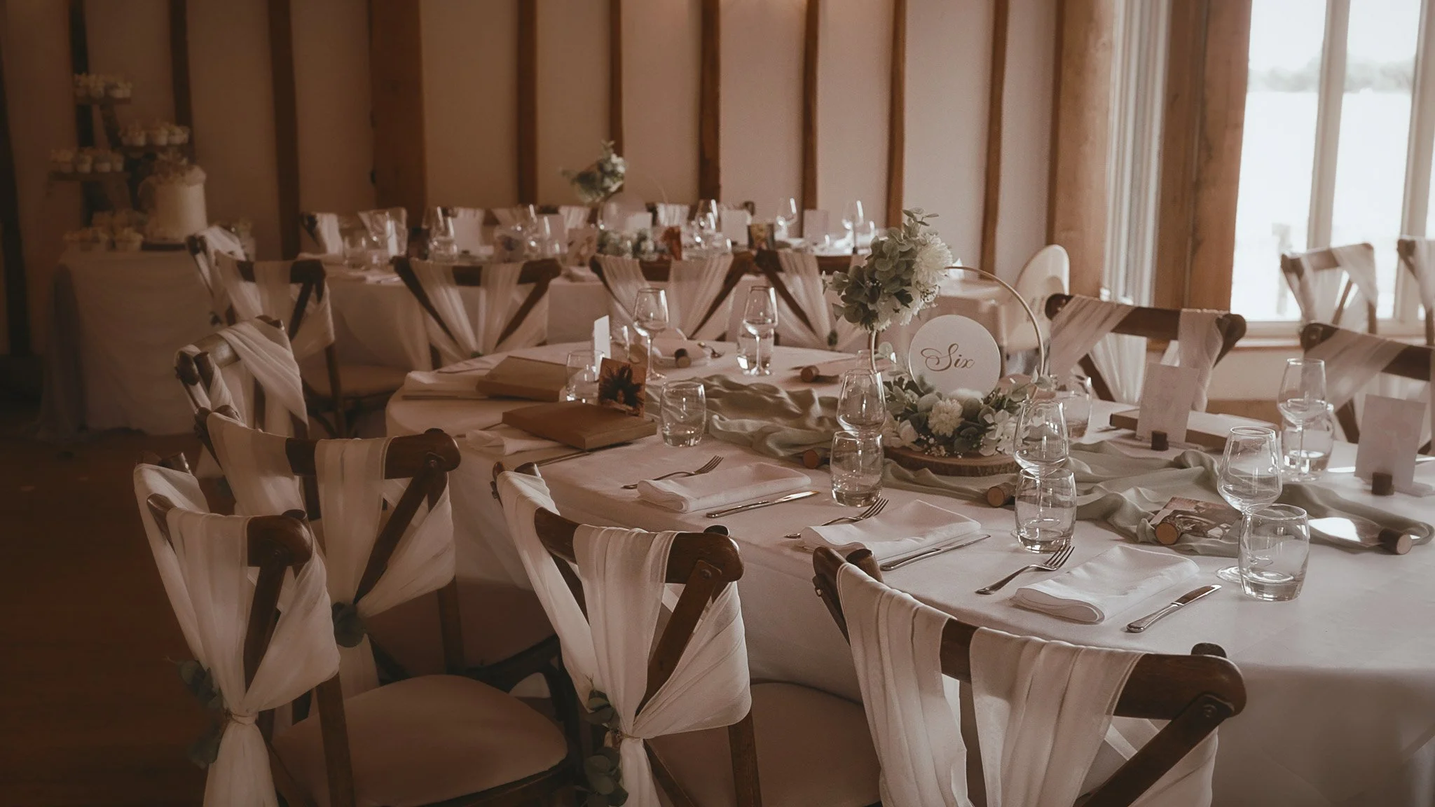 Baronial Barn wedding breakfast setup at Vaulty Manor in Essex