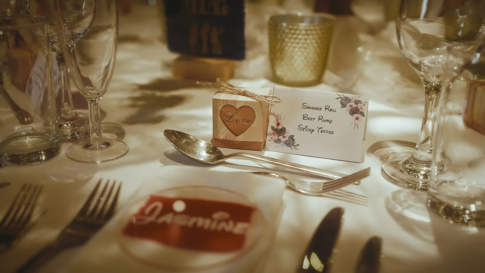 Reception tables set for dinner at Cooling Castle Barn barn wedding