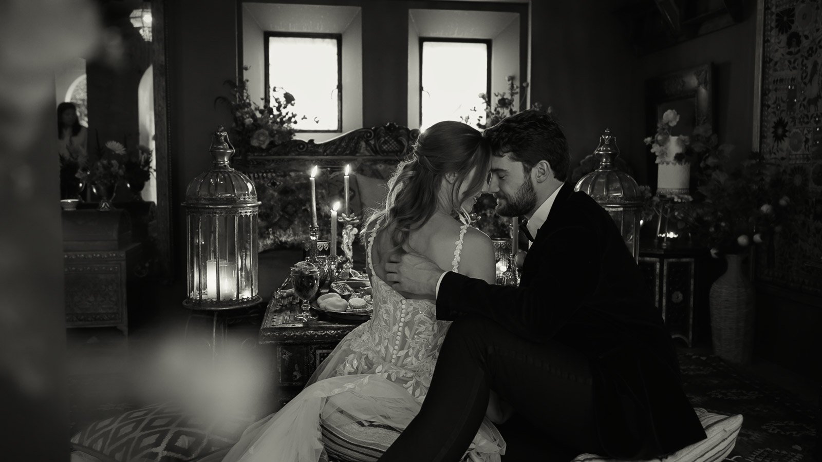 Intimate black and white fine art moment between a bride and groom during their wedding reception.