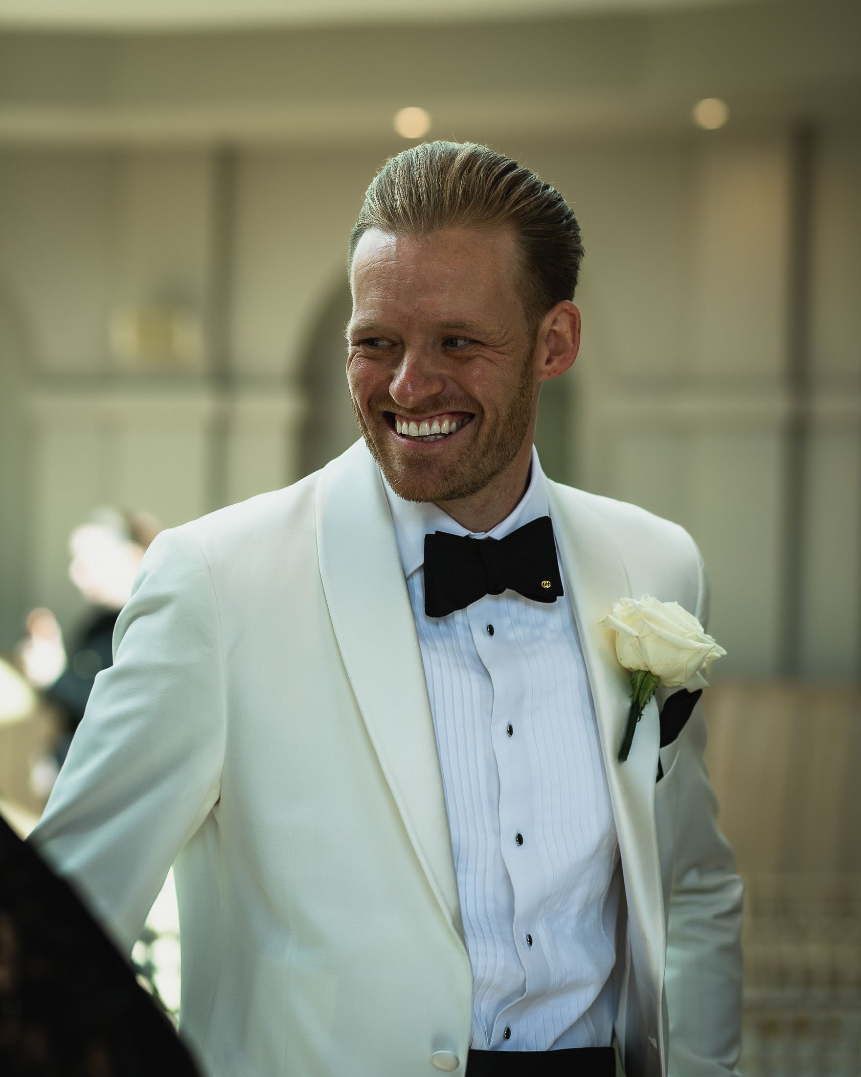 Groom portrait at an indoor ceremony at The Orangery Maidstone wedding venue in Kent.