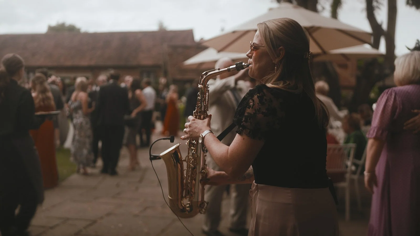 Saxophonist performing during the Winters Barns after party, bringing energy to the dance floor.