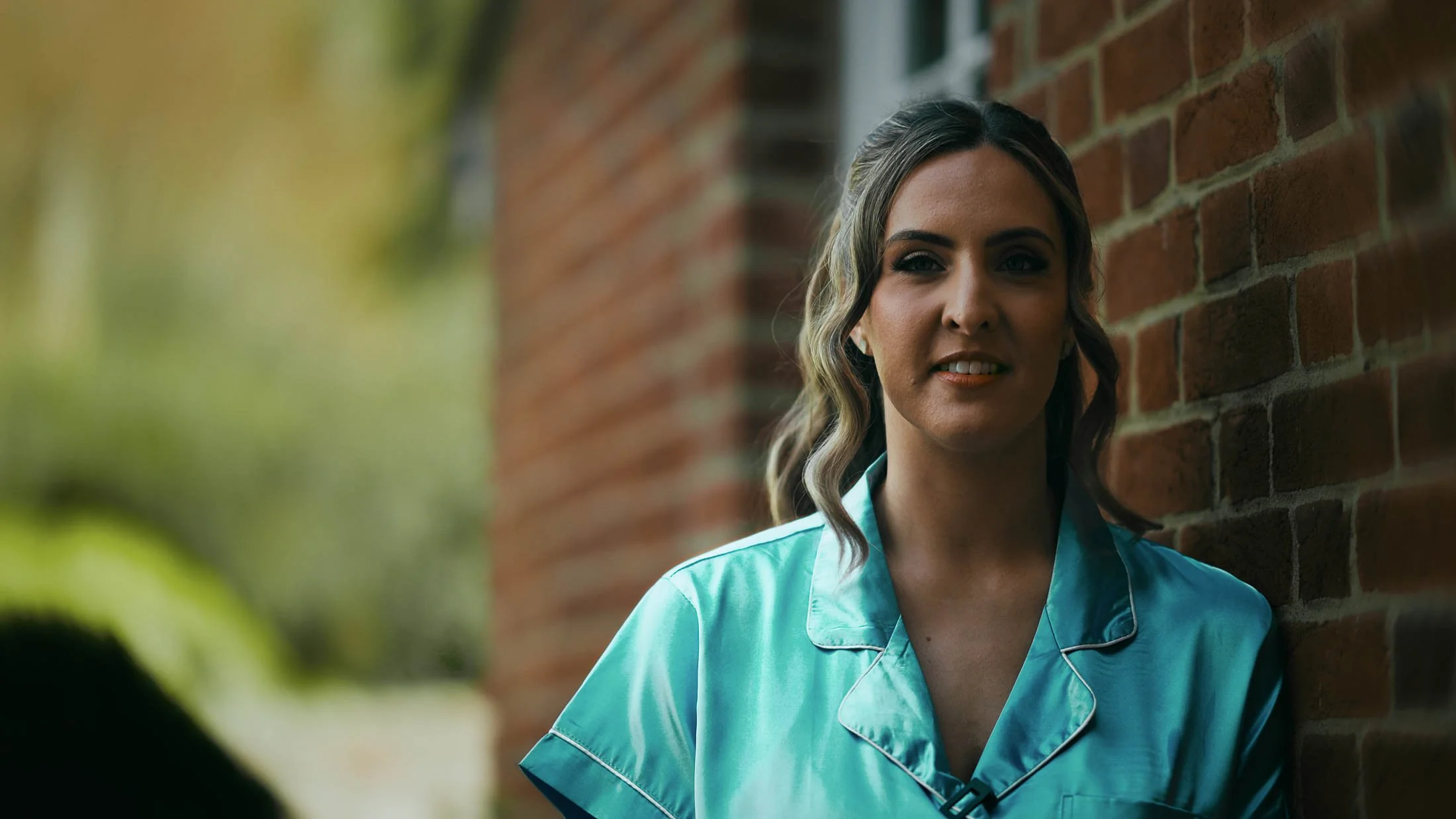 As part of a cinematic storytelling wedding film in the UK, a Bridesmaid gives an interview to camera as part of the narrative and story of the couple.