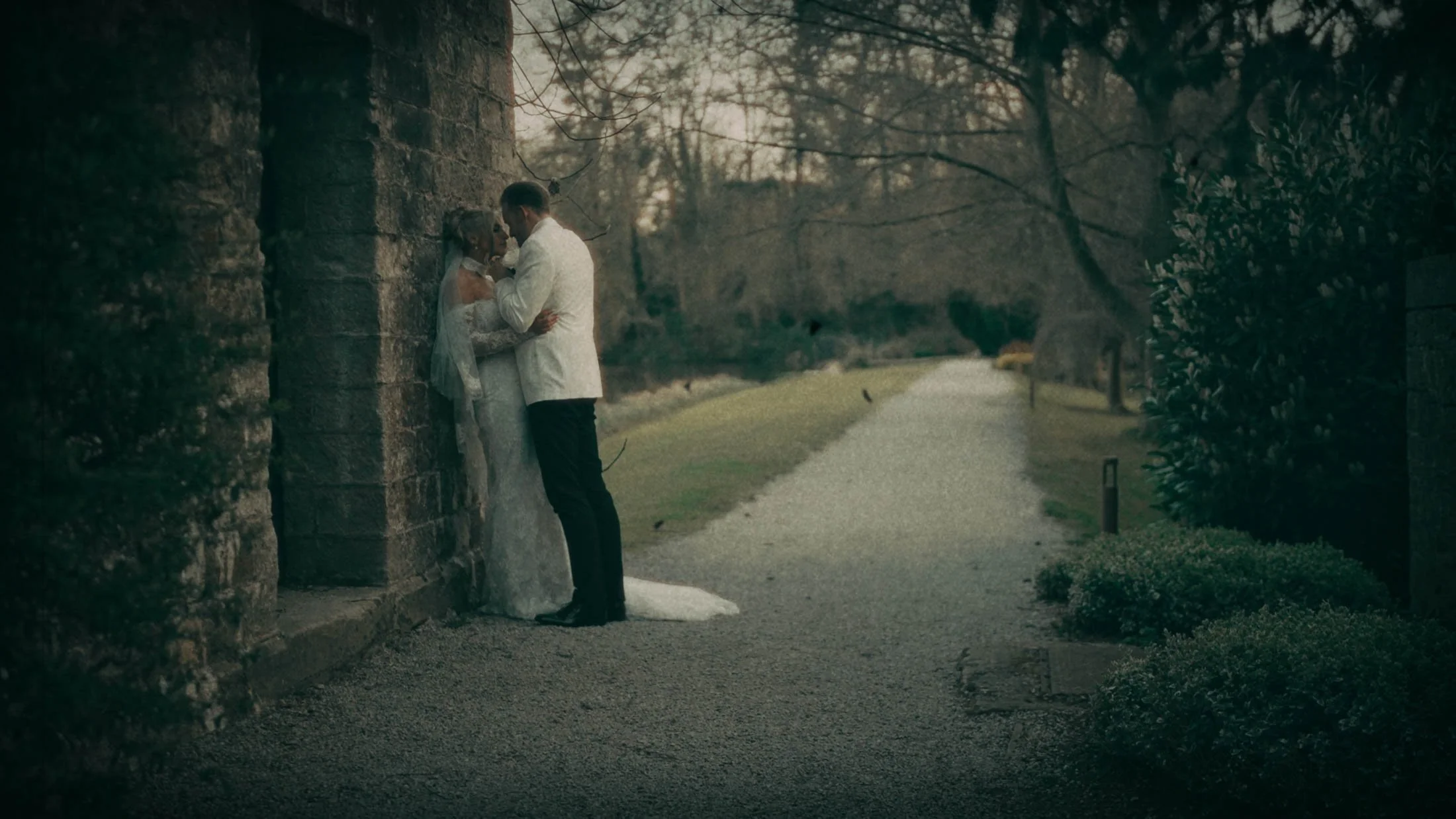 A super 8mm wedding film moment as a couple pose together during golden hour at The Orangery Maidstone.