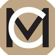 A logo with a large white circle overlapping a black letter V on a beige background.