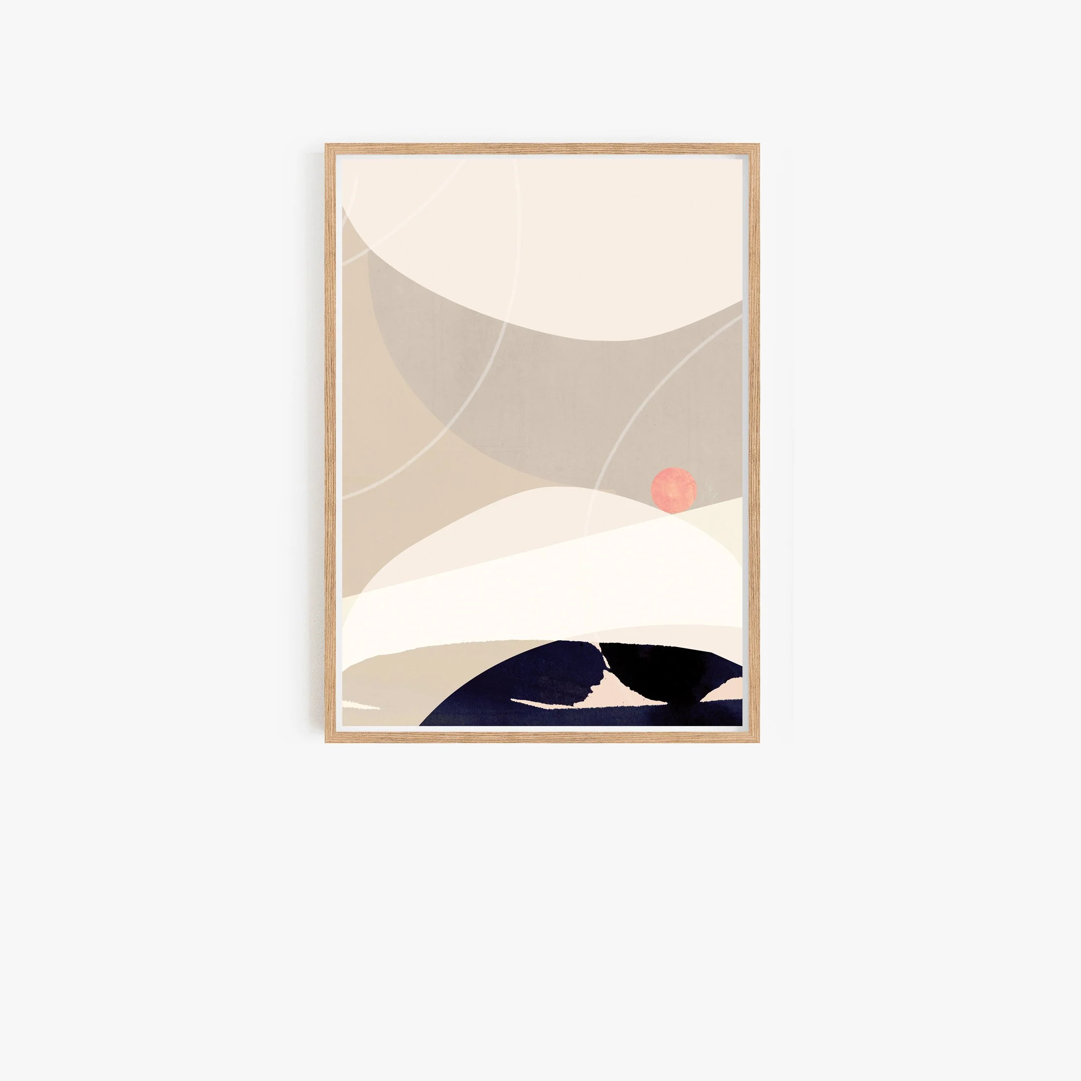 Abstract wall art with neutral beige, white, and black shapes and a small pink circle, framed in light wood.