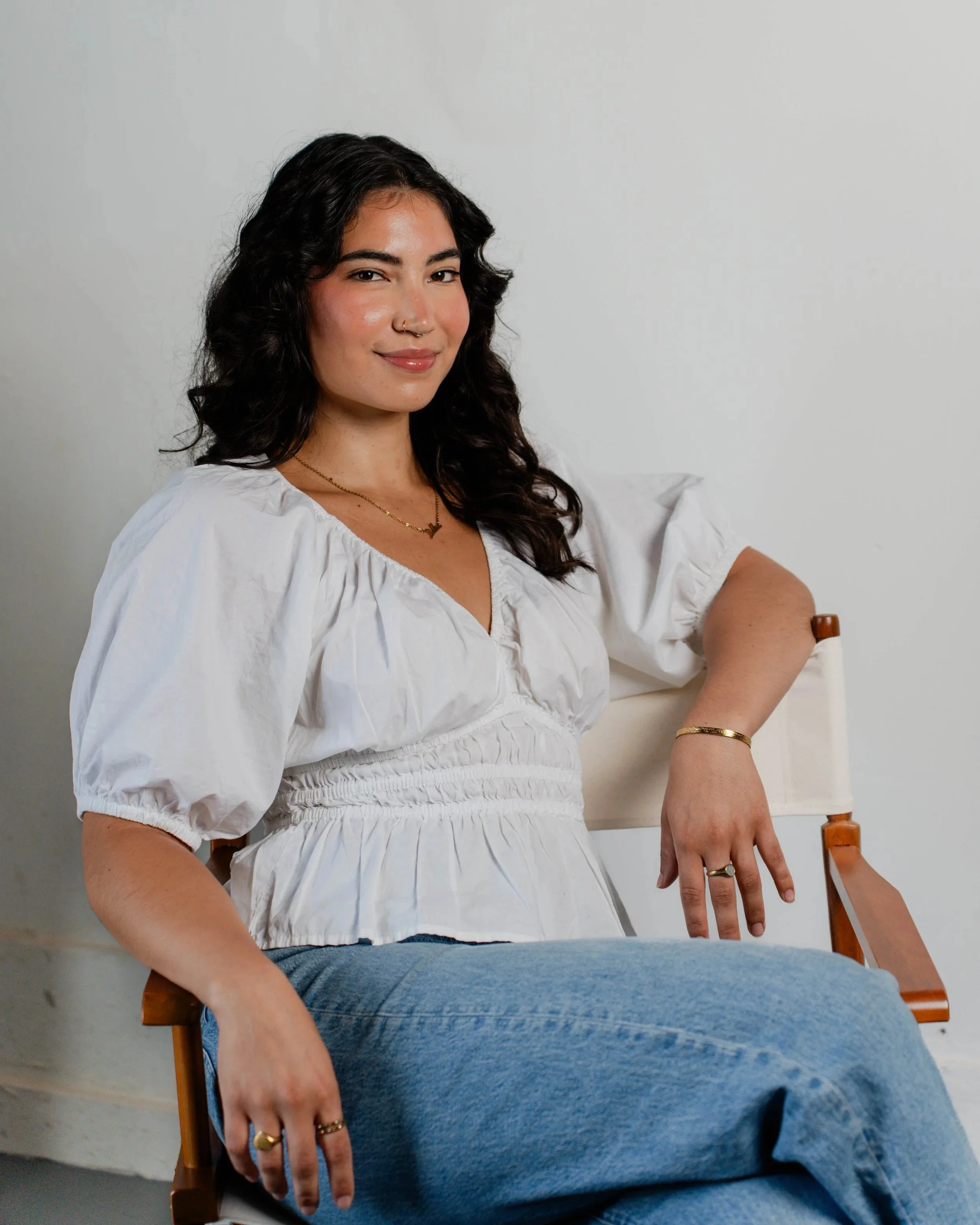 Headshot profile photo of Delia Flores posing