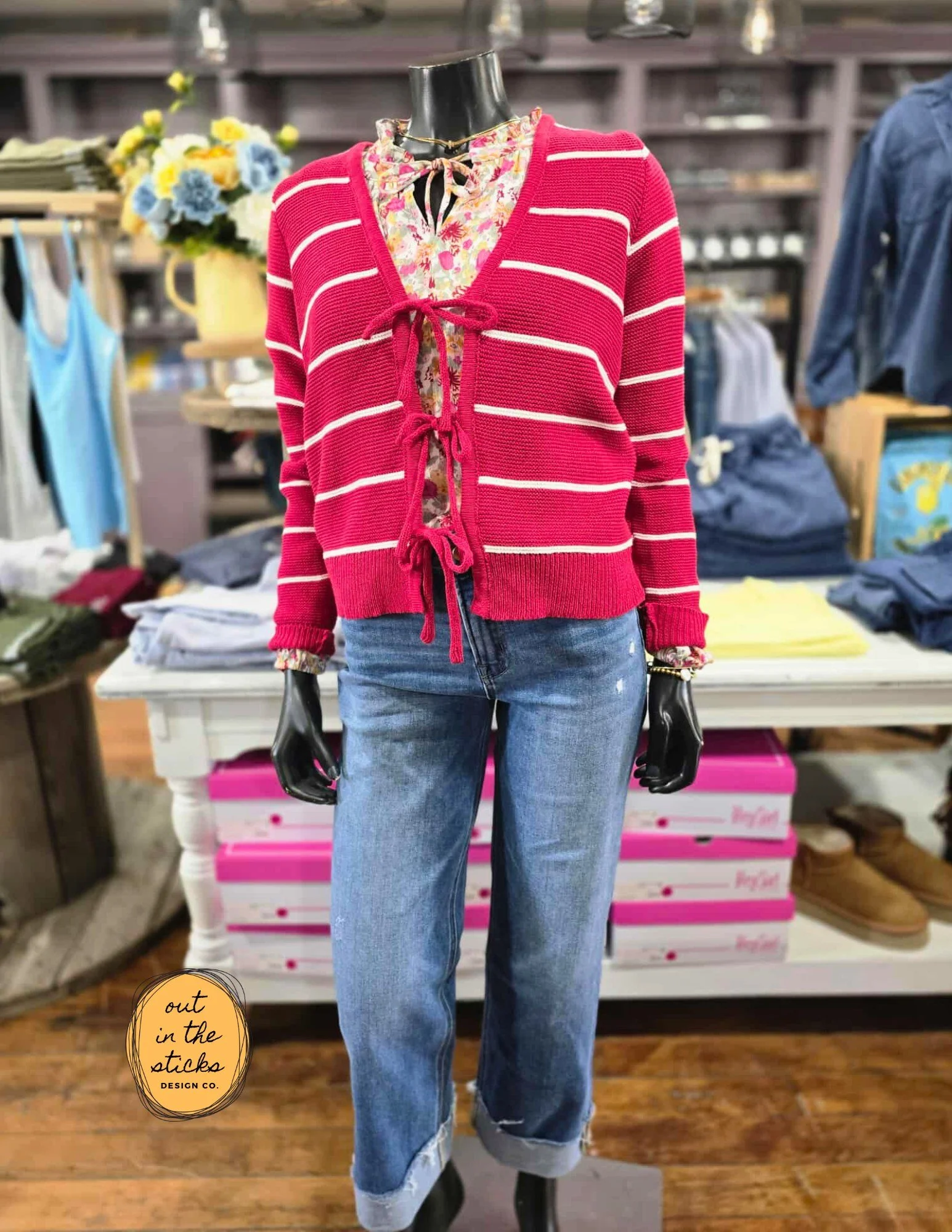 A little play on yesterday's featured top - a customer paired these two together and it was too cute not to share! Stripes are huge this year in any color, variation, direction...stripes are everywhere. Our red striped tie front sweater paired with t