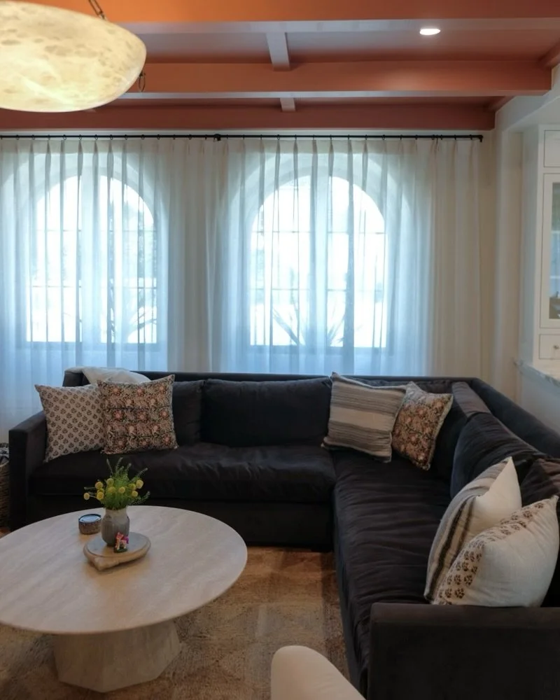 Spanish Revival Living Room | Crown Pleat Sheer Drapery | Belmont Heights, Long Beach

The living room in this Long Beach 1930&rsquo;s Spanish revival was framed by a large format cordless Roman shade on the south facing courtyard window and this unl