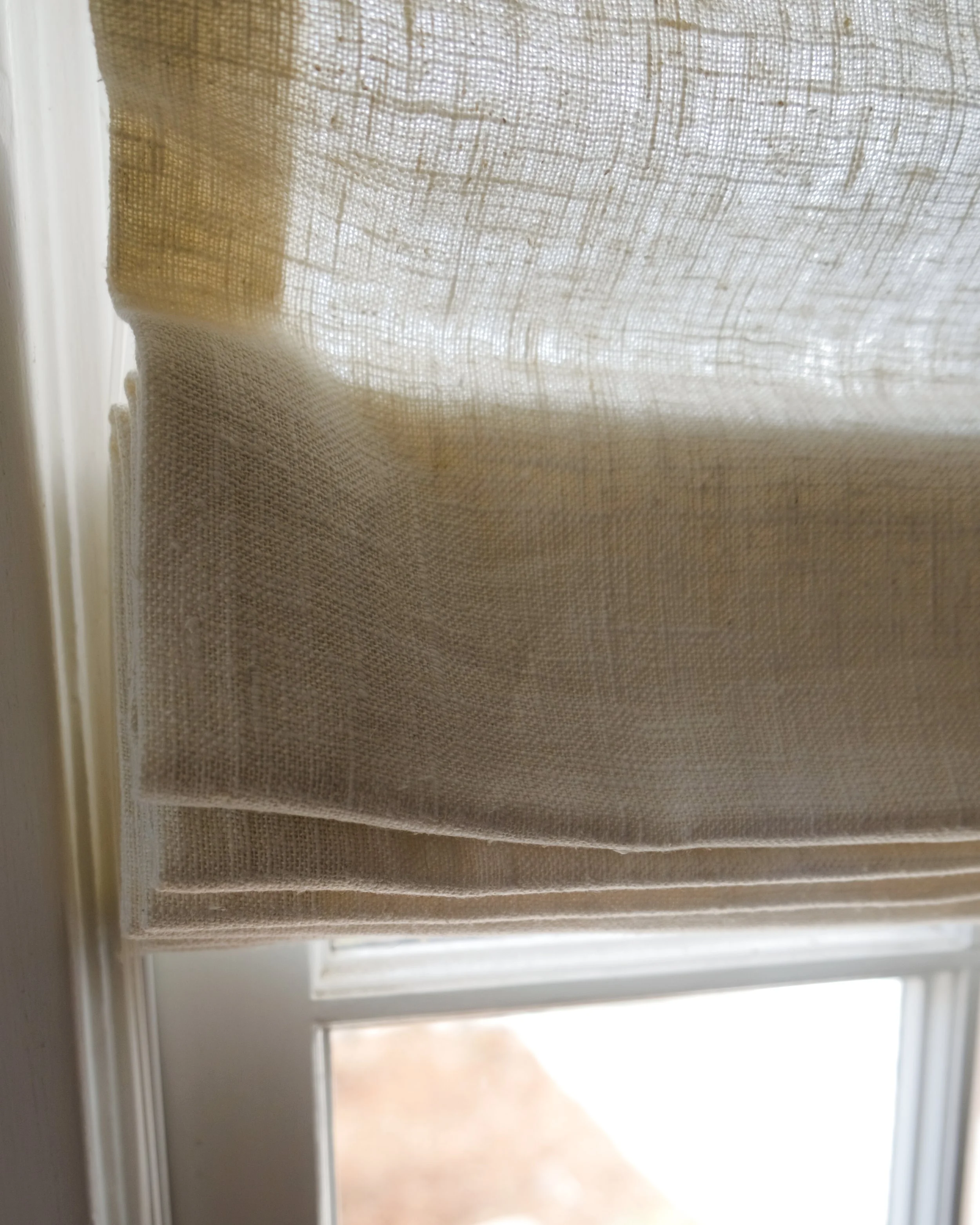 A simple linen roman shade in southern california
