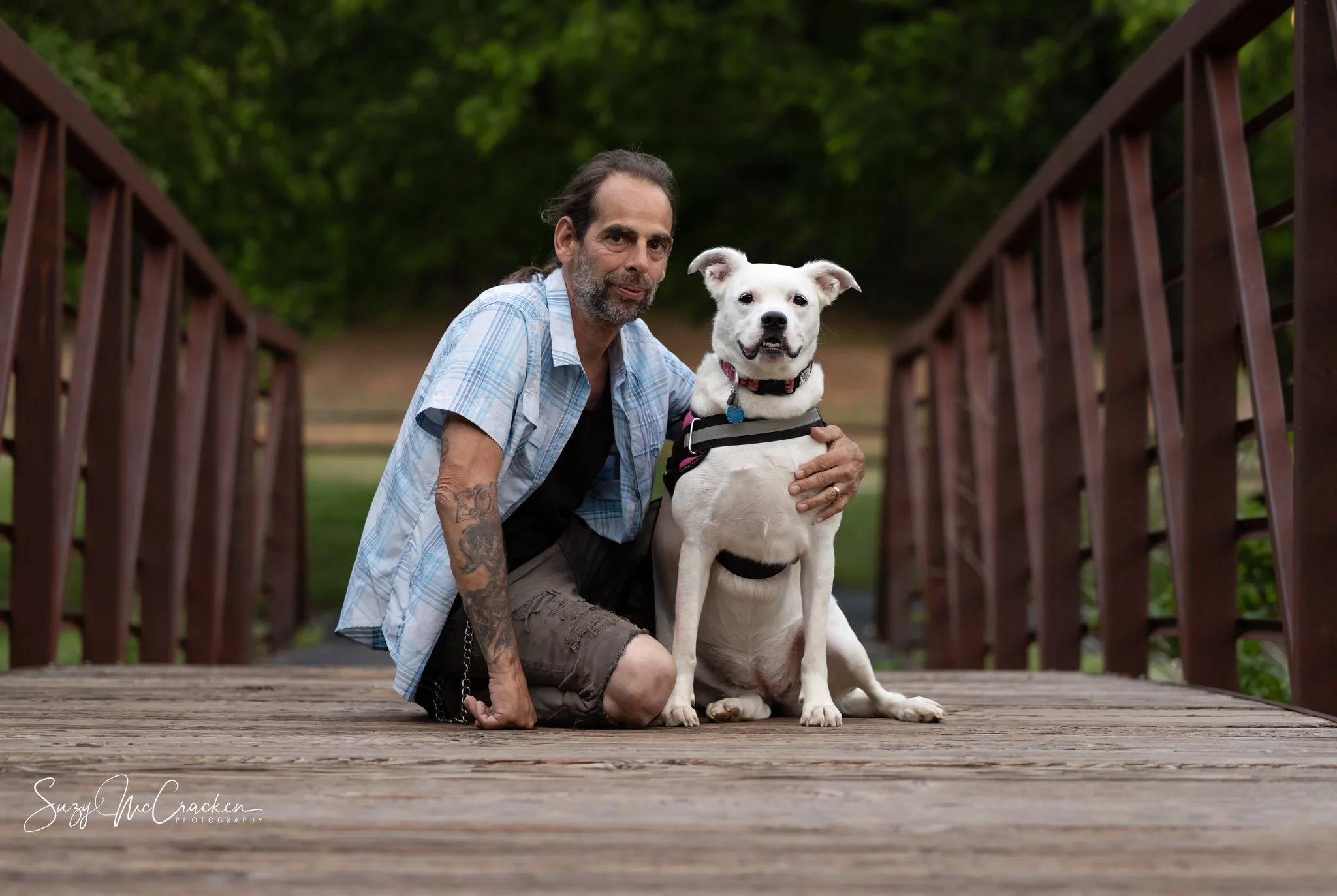 Man and dog on bridge