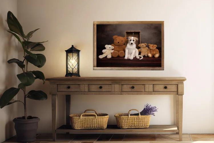 Framed portrait of puppies above a sideboard