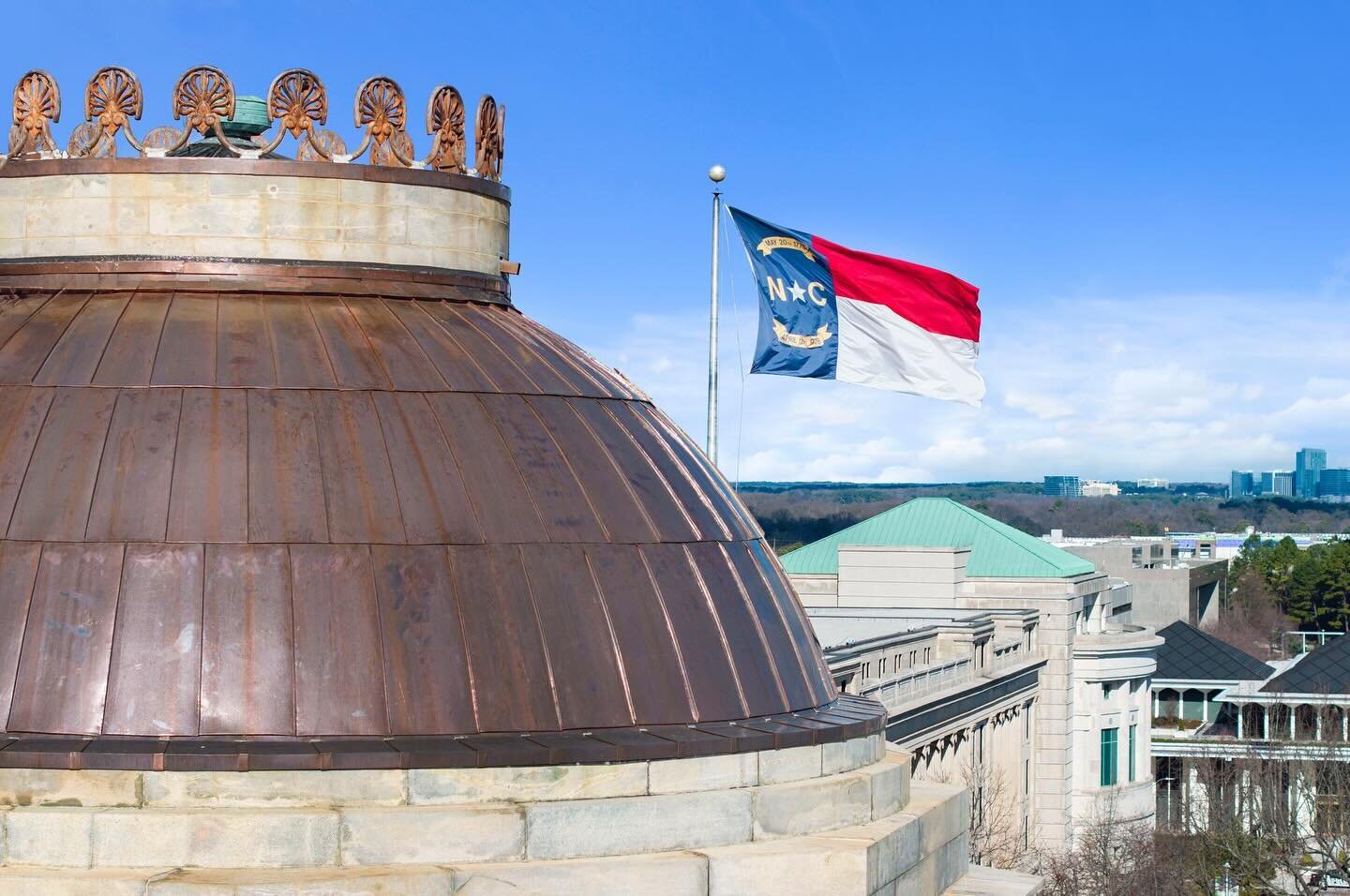 Beautiful day at @ncstatecapitol Raleigh, NC! 
&bull;
#raleighnc #dronephotography #statecapitol #ncstatecapitol #copperdome #newroof #ncflag #raleighphotographer