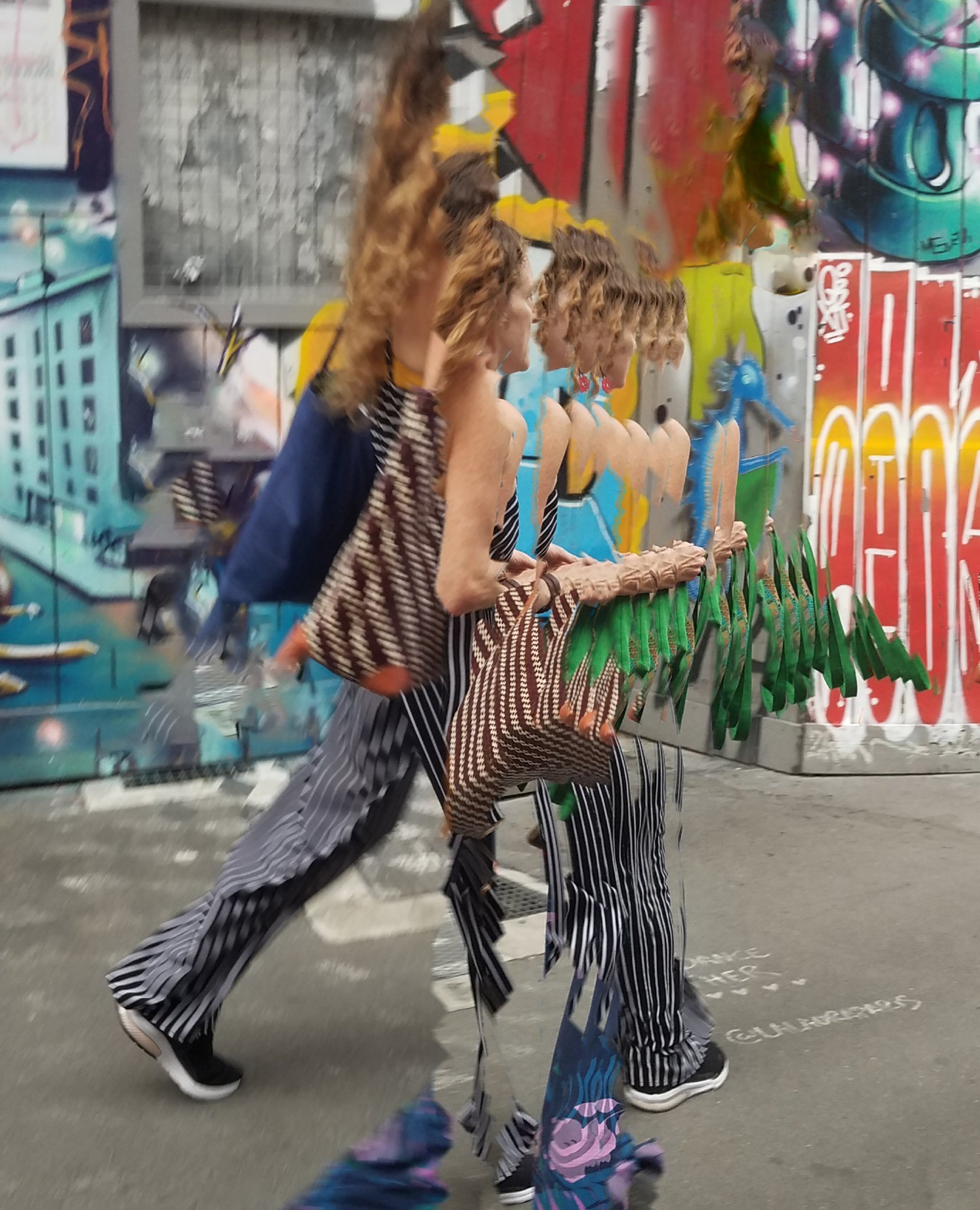 AI 2x and content aware zigzag graffiti adjusted woman walking 20220910_091439 copy.jpg
