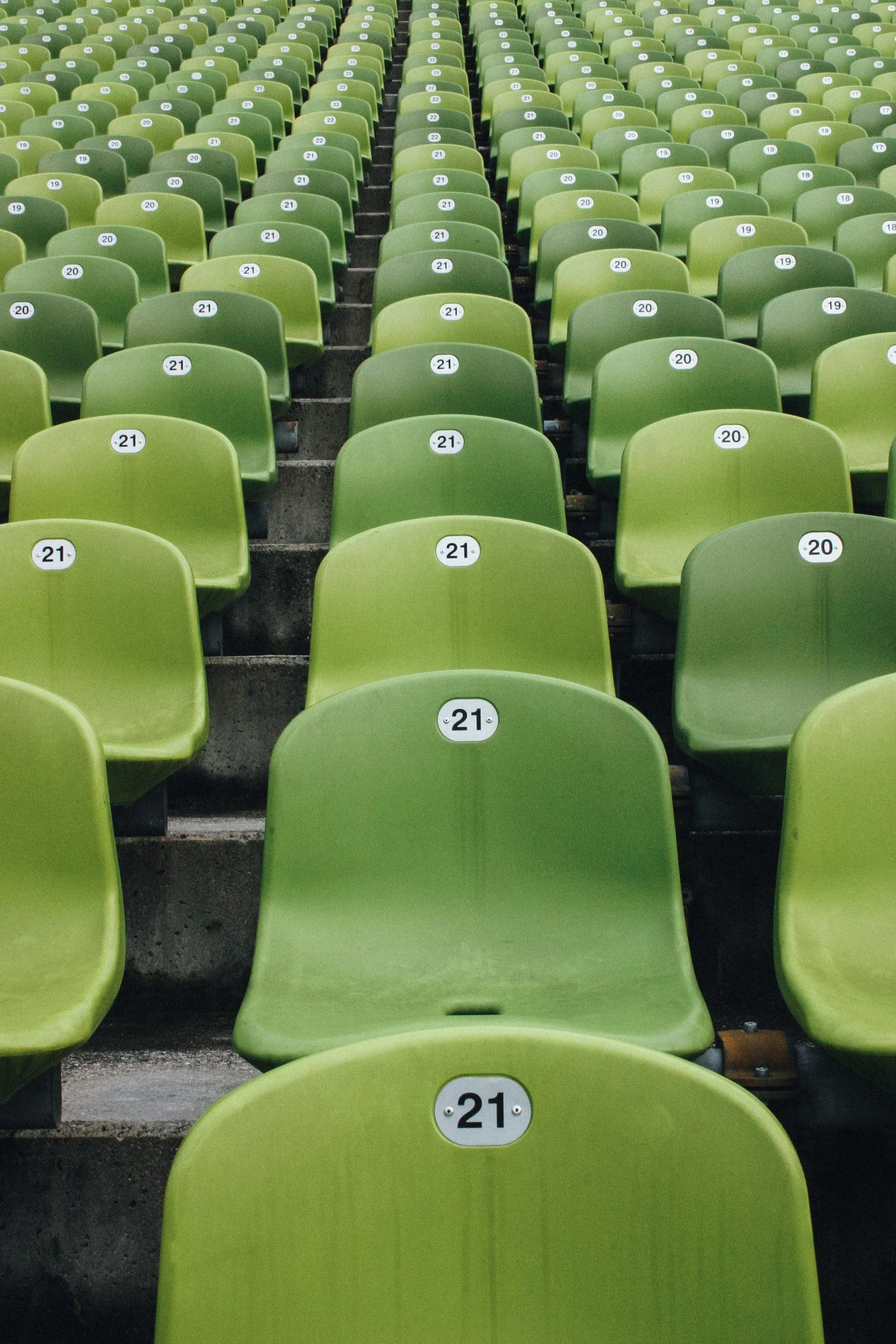 Rows of numbered, green stadium seats