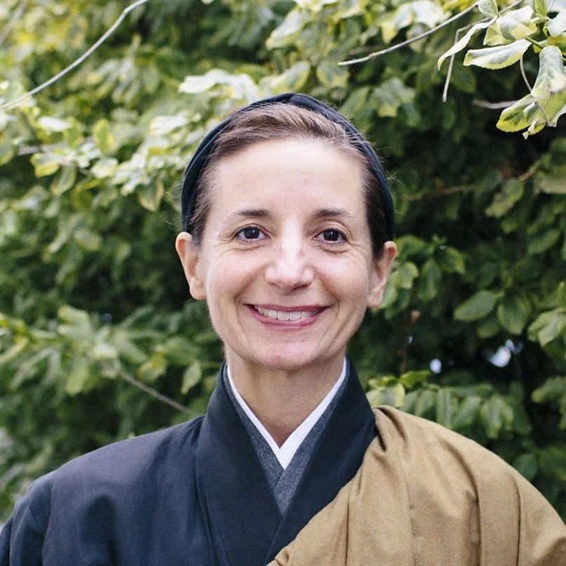 Portrait of a zen teacher wearing a kimono and smiling