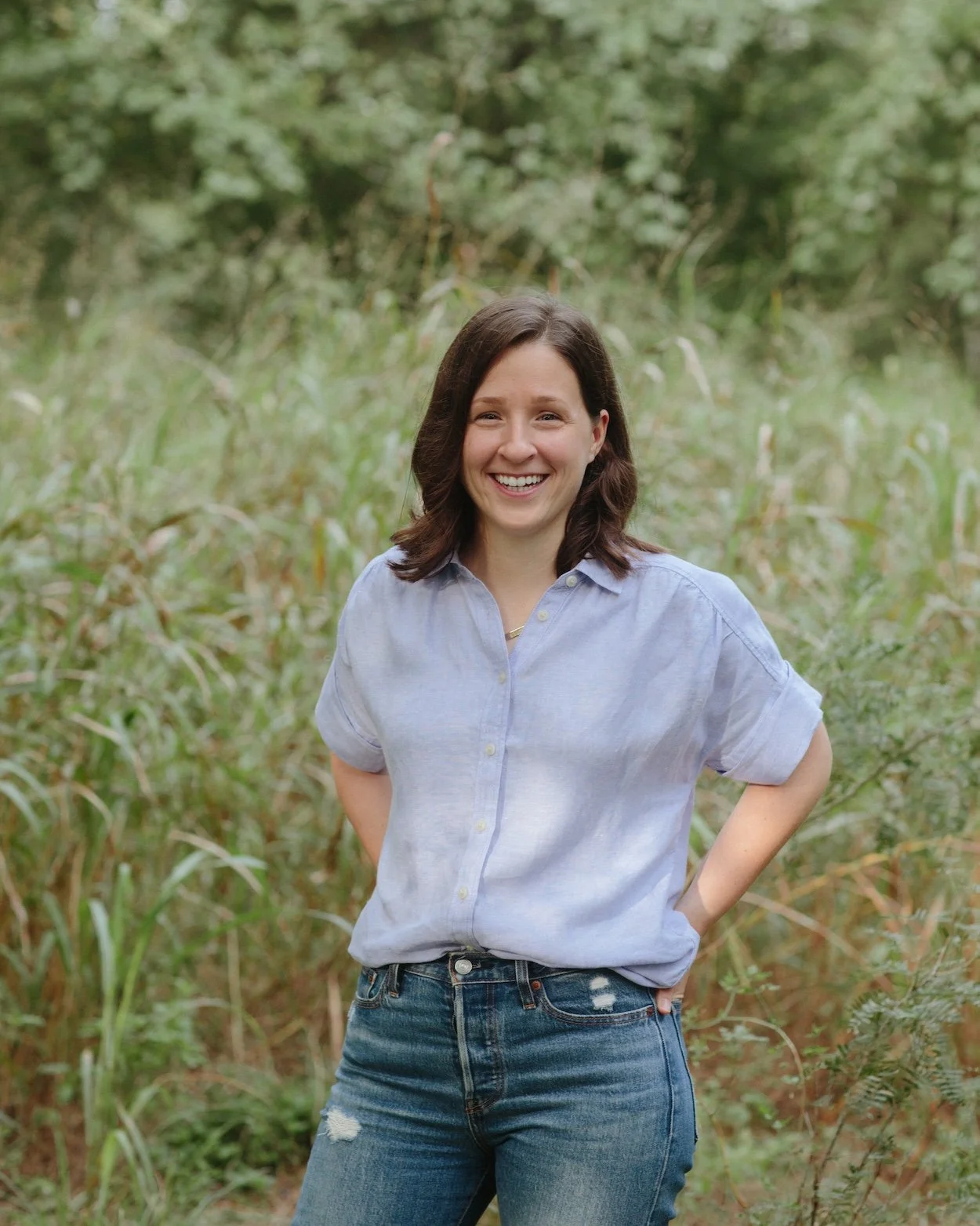 Rebecca Magee, founder of Sister Seasons, smiling outdoors in a natural setting