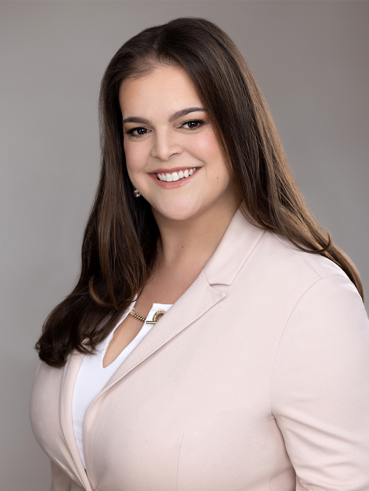 am image of Katie Hatfield smiling at the camera