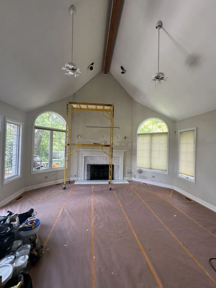 the process of painting a room with high pointed ceilings.jpg