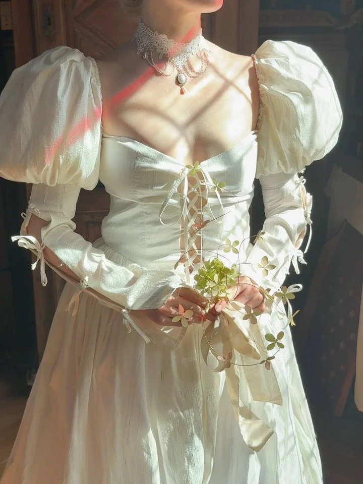 an old world fairytale but with a little modern floral twist 

Stylist @taylarphoto
Couple @roseplusoliver
Florals @merci.floral
Dress @odylynetheceremony
Shoes @dolcevita
Tablescapes @brittwarnickdesigns
Hair @hairbynataliekc