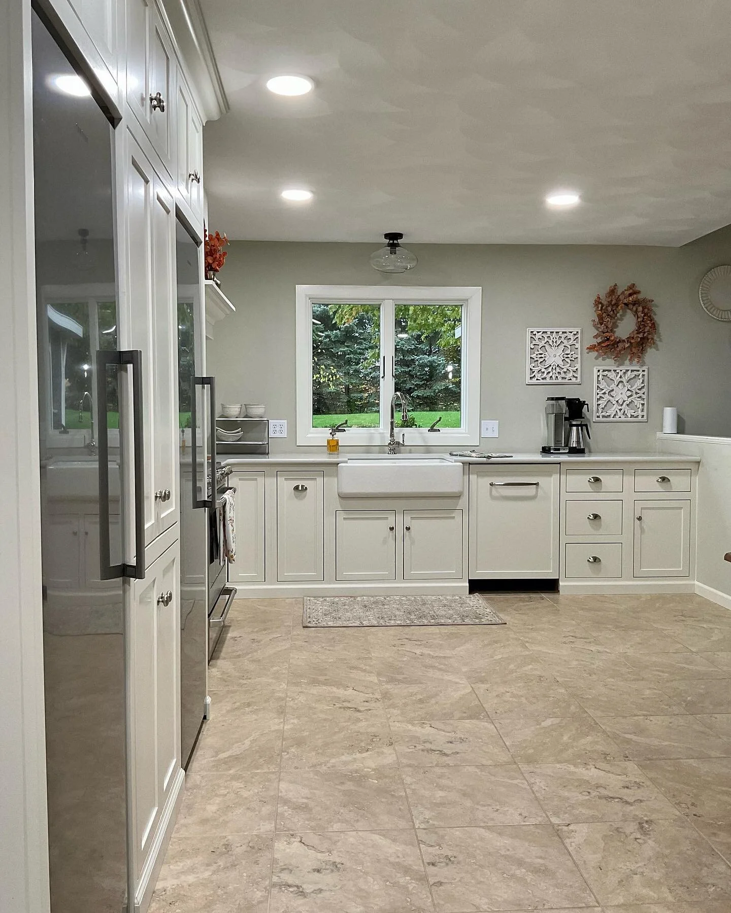 Super happy with the outcome of this custom kitchen. Inset, shaker style cabinets and a beautiful coffee bar with glass uppers.