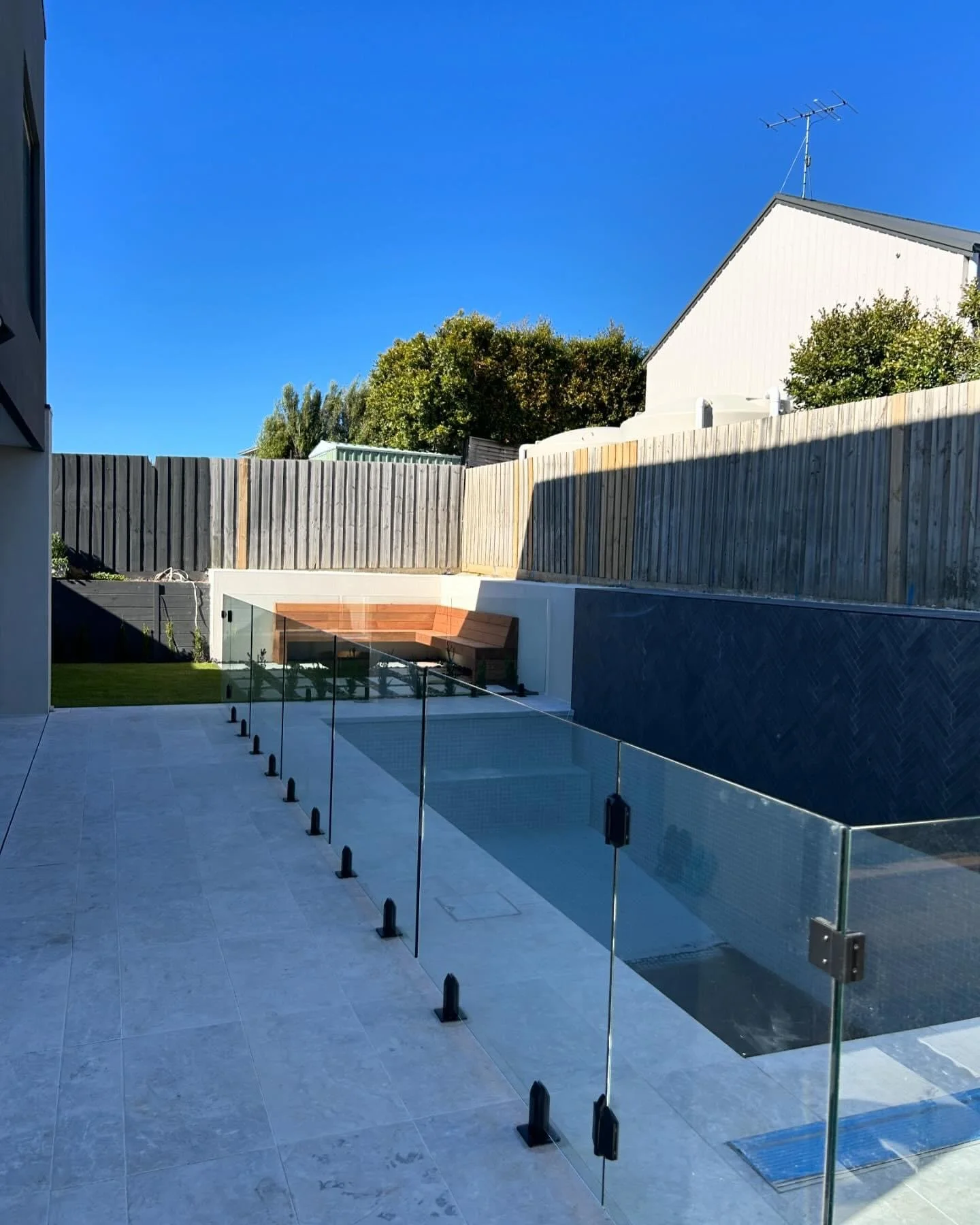 Pool Surrounds - paving, glass fence