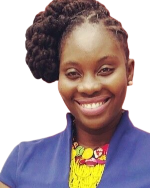 Portrait of a young woman smiling, wearing a blue jacket and a colorful shirt, with braided hair.