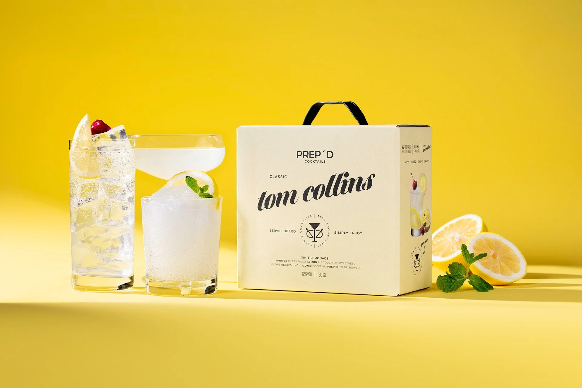 färdigblandad cocktail Tom Collins med gin i box med citron och is