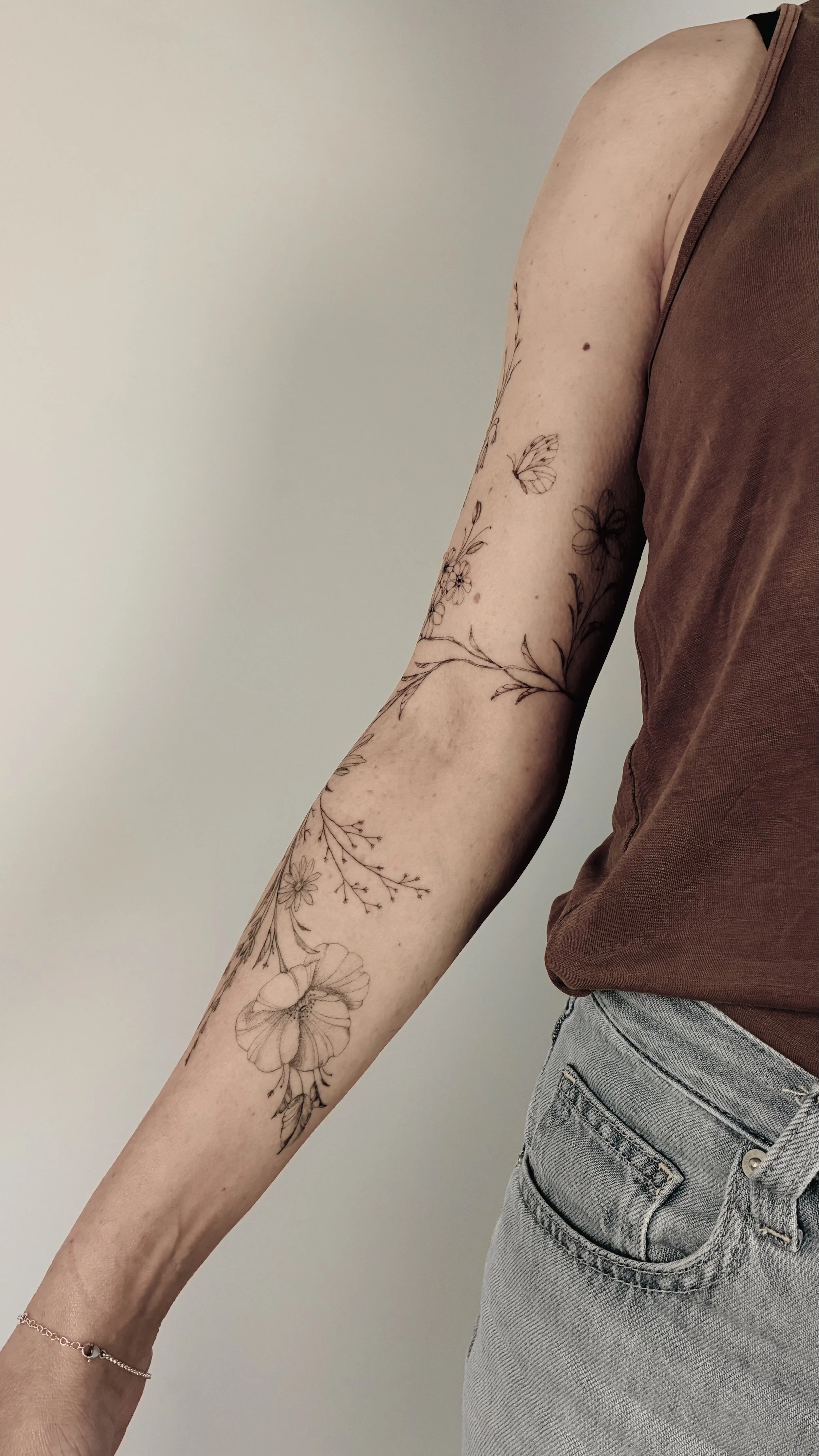 A fineline botanical tattoo at Inkwaves Studio