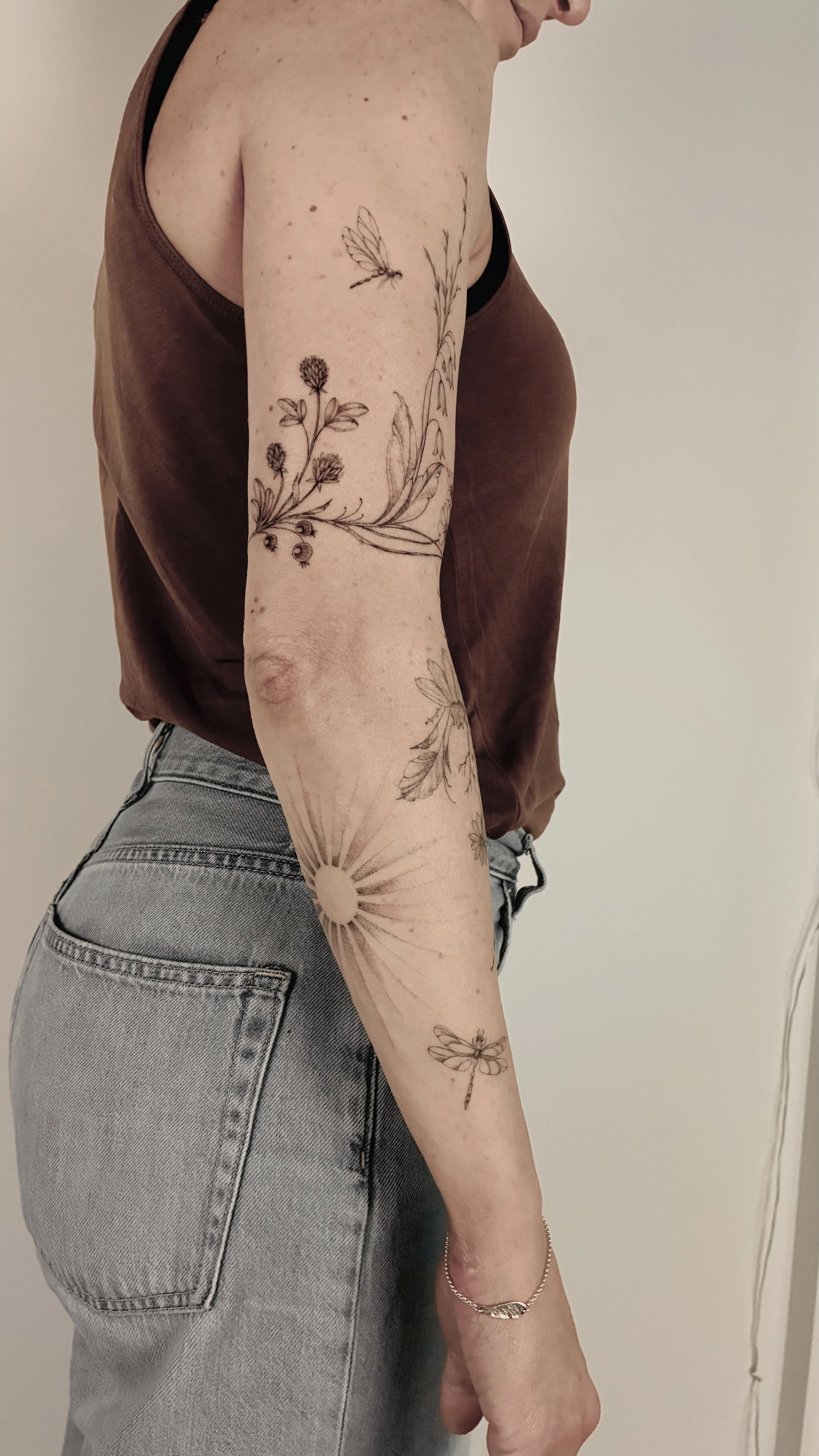 A fineline botanical tattoo at Inkwaves Studio