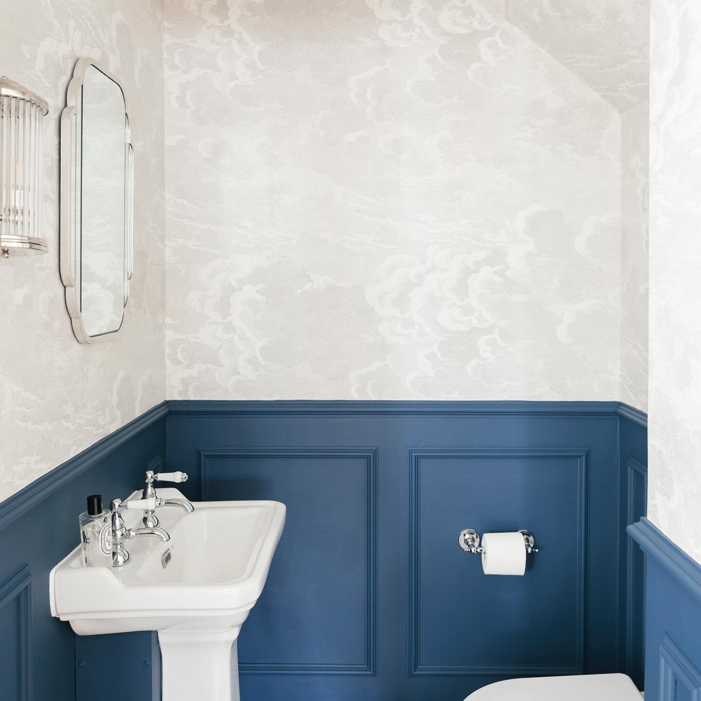We have so much pleasure in turning small unusable spaces into functional and beautiful ones. Swipe for the progress and before. 

The cloakroom of our Essex project with Fornasetti Nuvolette Wallpaper and Contrast Stiffkey Blue with panelling and ch