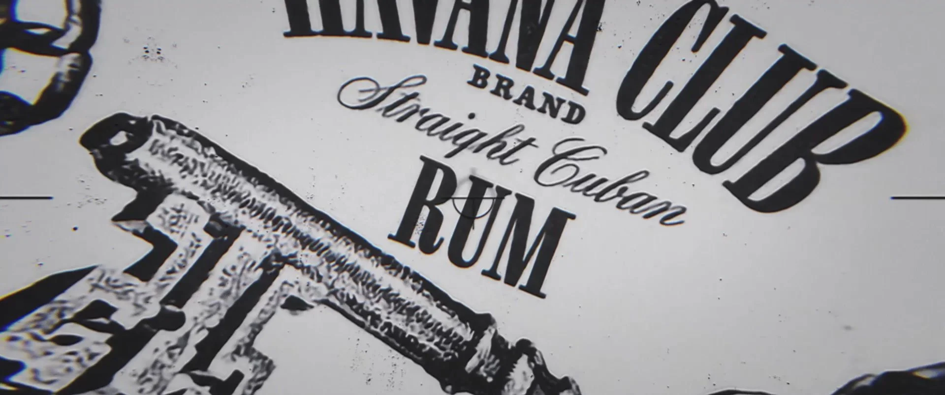 Close-up of black and white label text reading 'Havana Club Brand Straight Cuban RUM' with a depiction of a rum bottle.