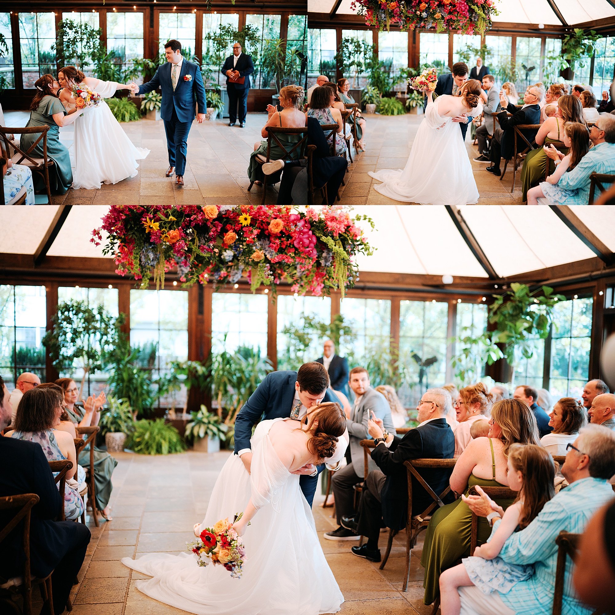 Newly married bride and groom recess with a dip under beautiful hanging florals