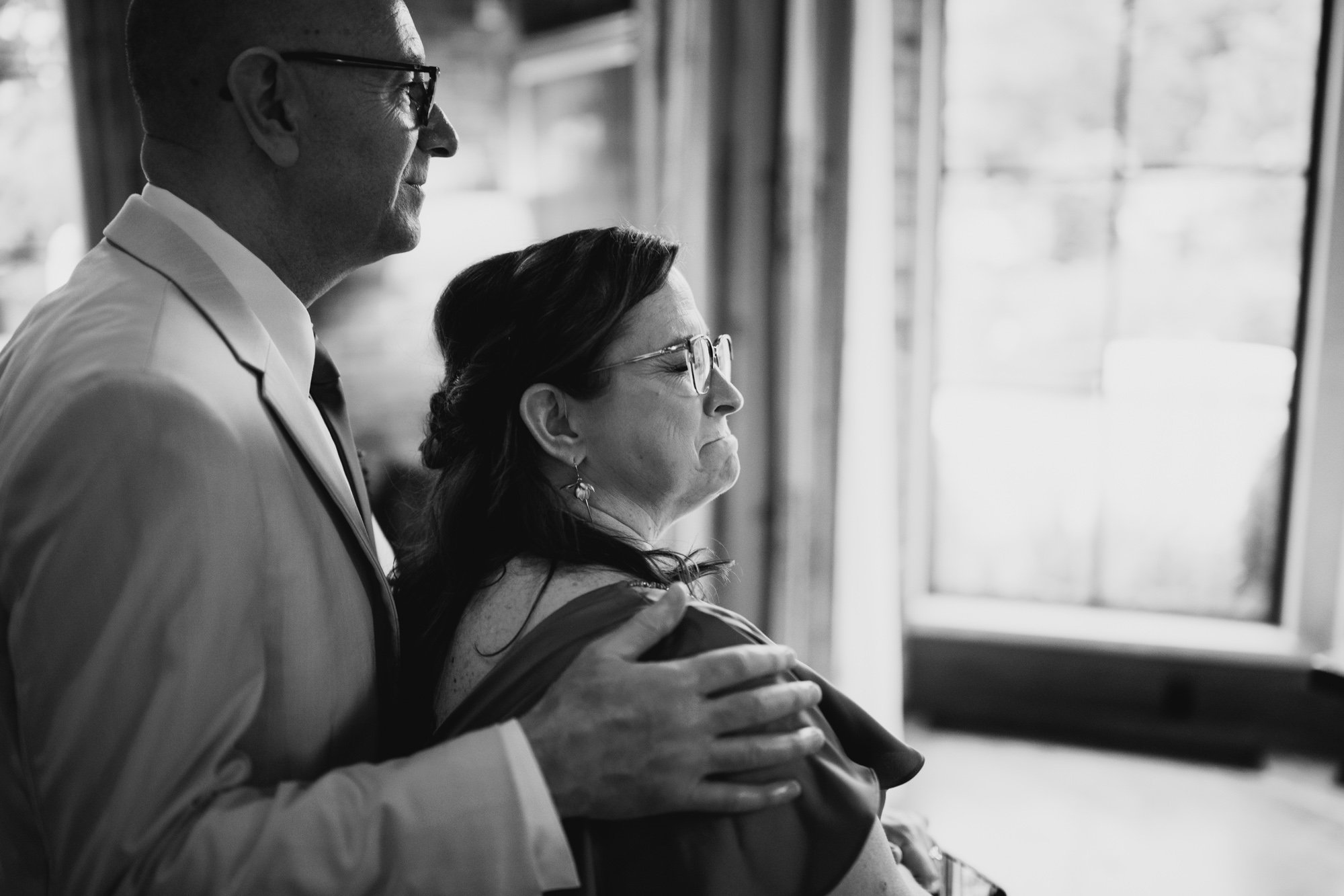 Mother and father of the bride get emotional after a wedding ceremony, documentary wedding photography at The Apiary in Lexington Kentucky.
