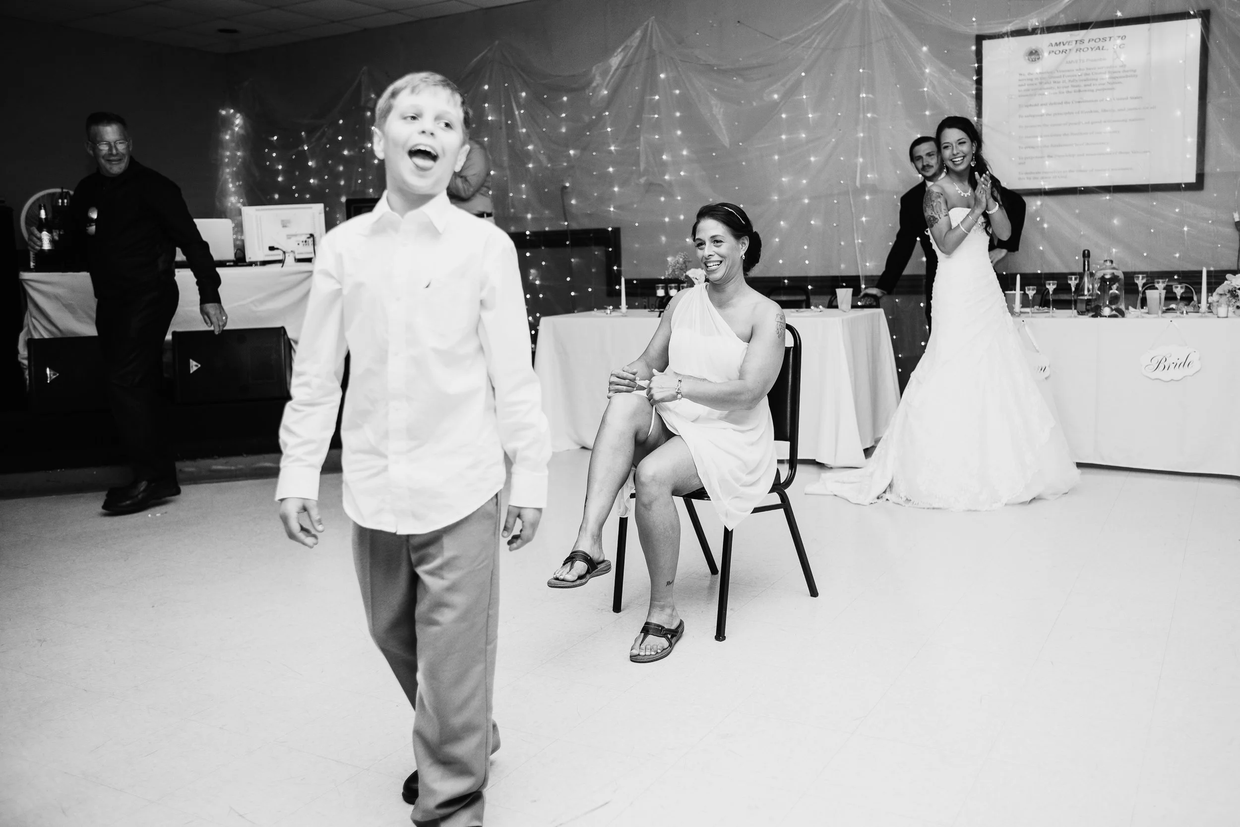 A funny reception moment captured through documentary wedding photography.