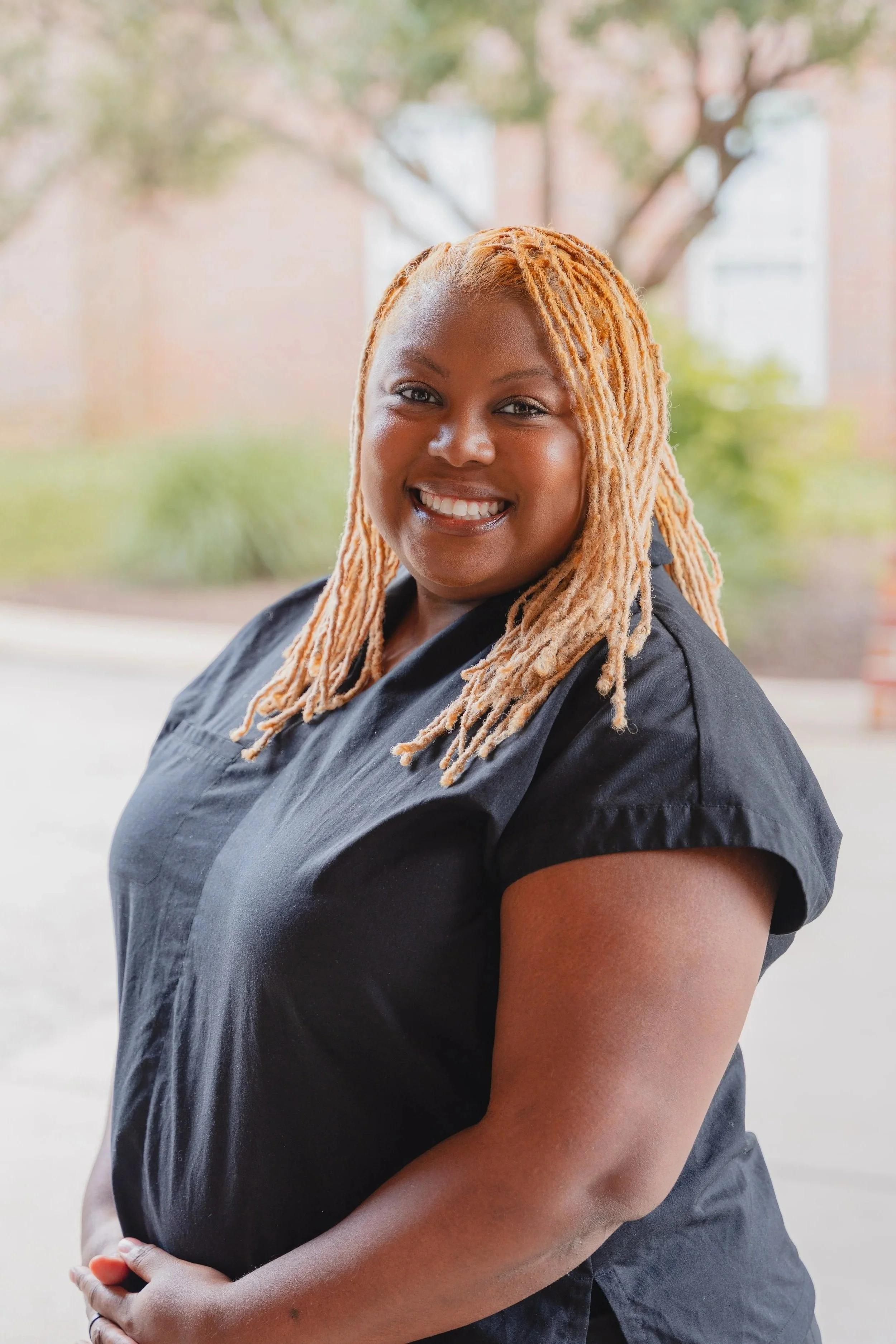 Outdoor headshot of Kimberly Myrick, Chief Sonographer at H&V