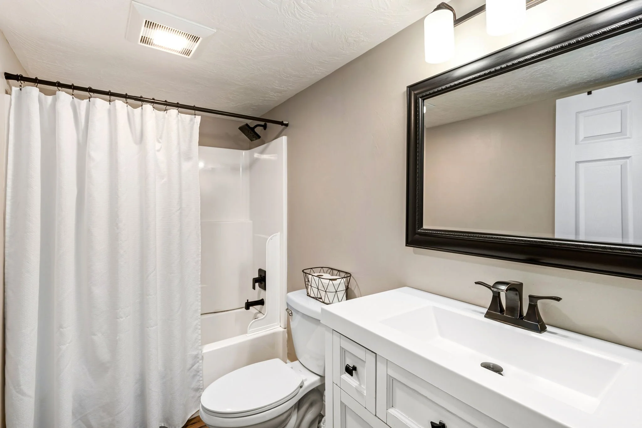 Wrecked-Refined-Luxe-Basement-Guest-Bath-Tub-Shower-Combo-Clean-Design-Great-Falls-MT-75.jpg.jpg