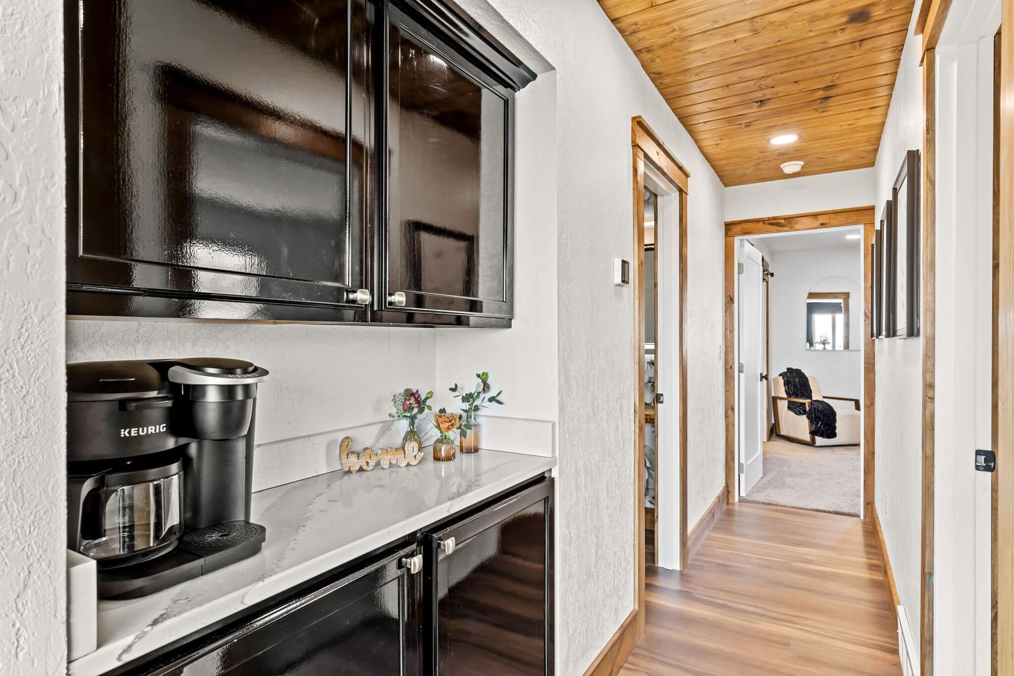 Renovated hallway with wood ceiling and modern finishes in a Great Falls, Montana home.
