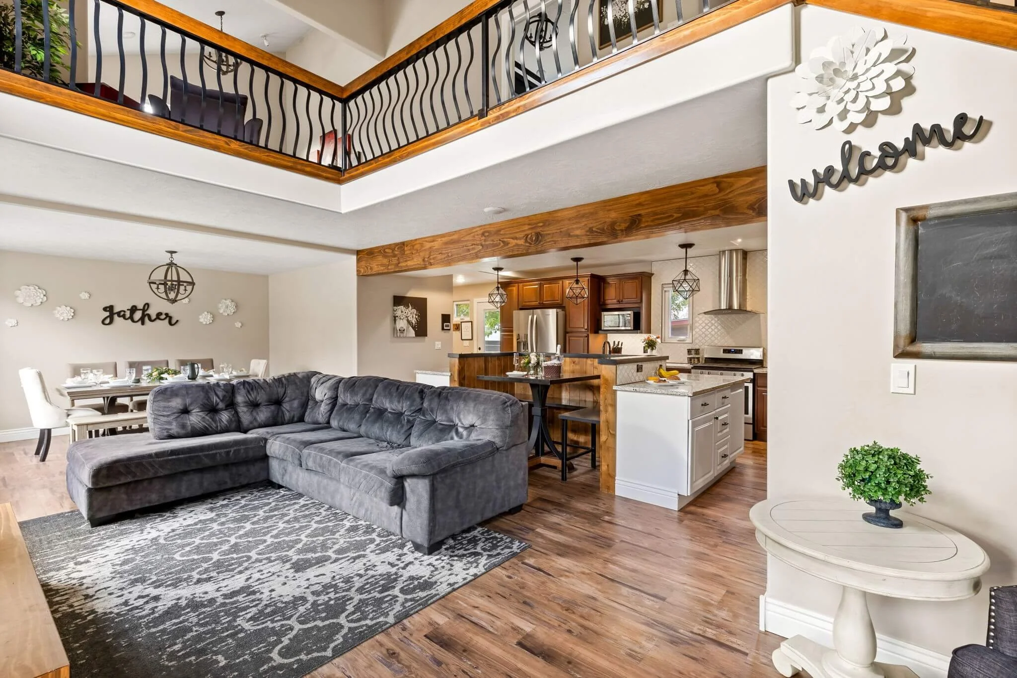 Open concept living room in a luxury Great Falls Montana home designed to create strong first impressions for buyers.