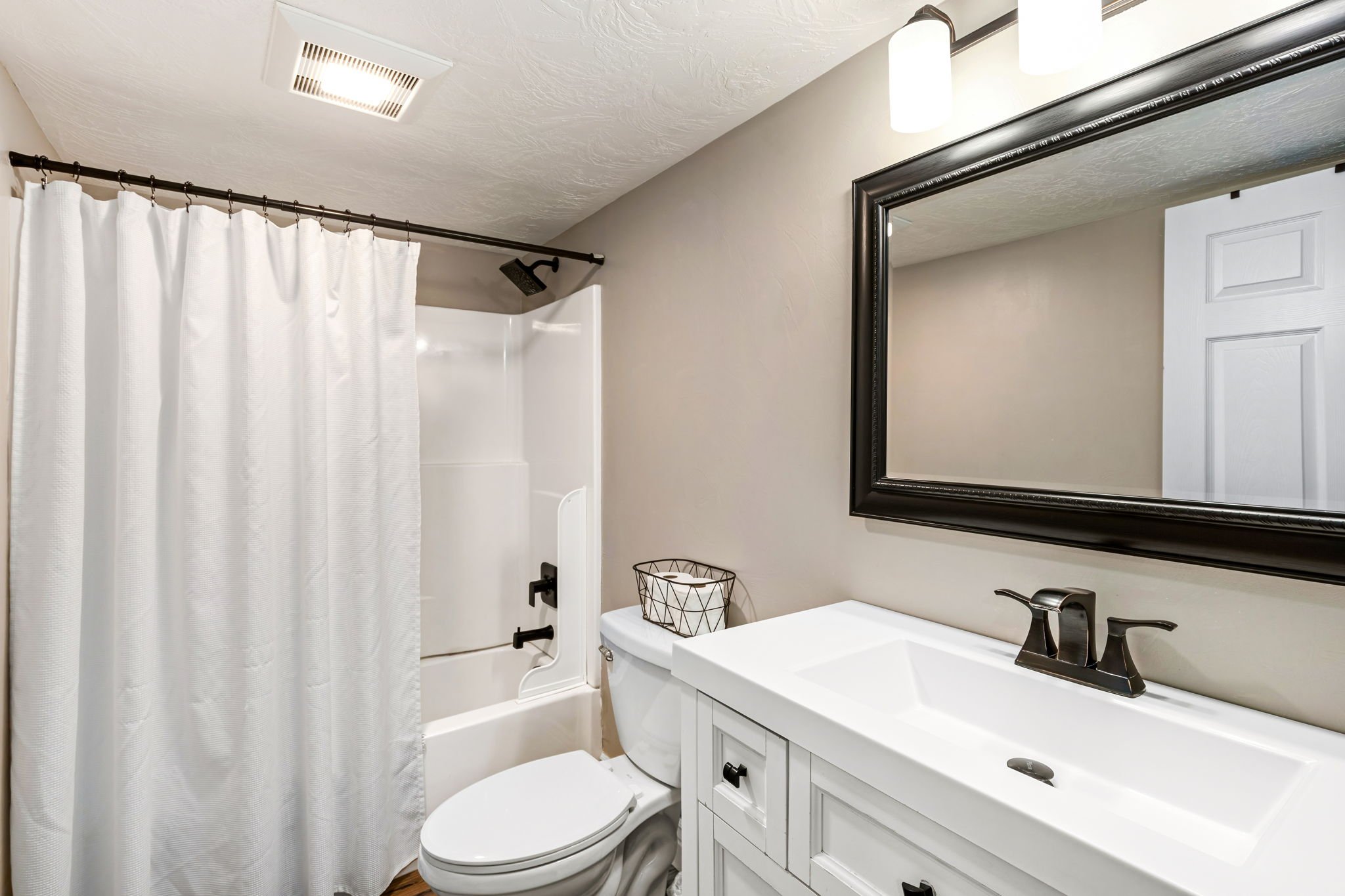 Wrecked-Refined-Luxe-Basement-Guest-Bath-Tub-Shower-Combo-Clean-Design-Great-Falls-MT-75.jpg.jpg