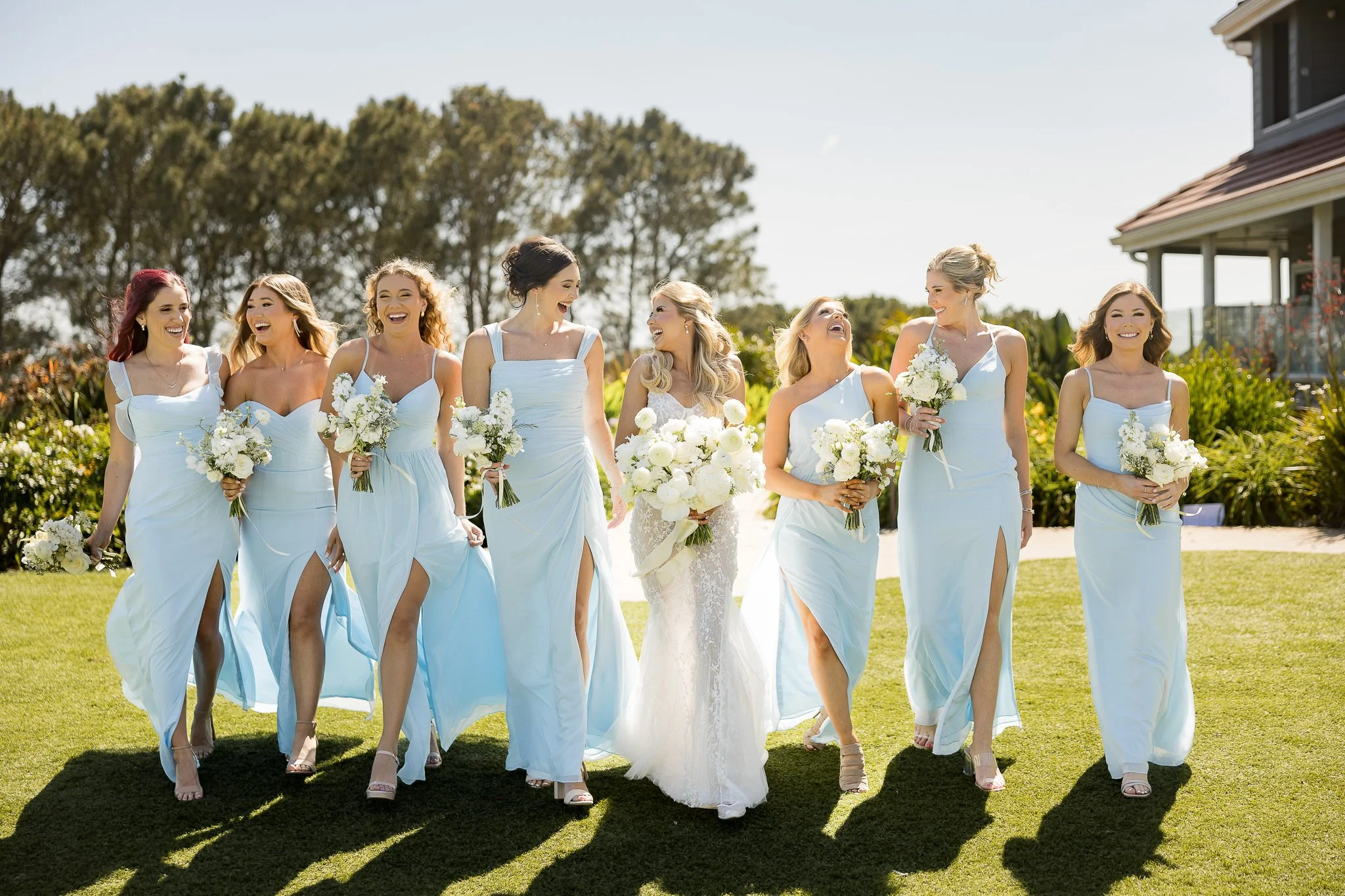 bridesmaids walking and laughing candidly after being given invisible direction